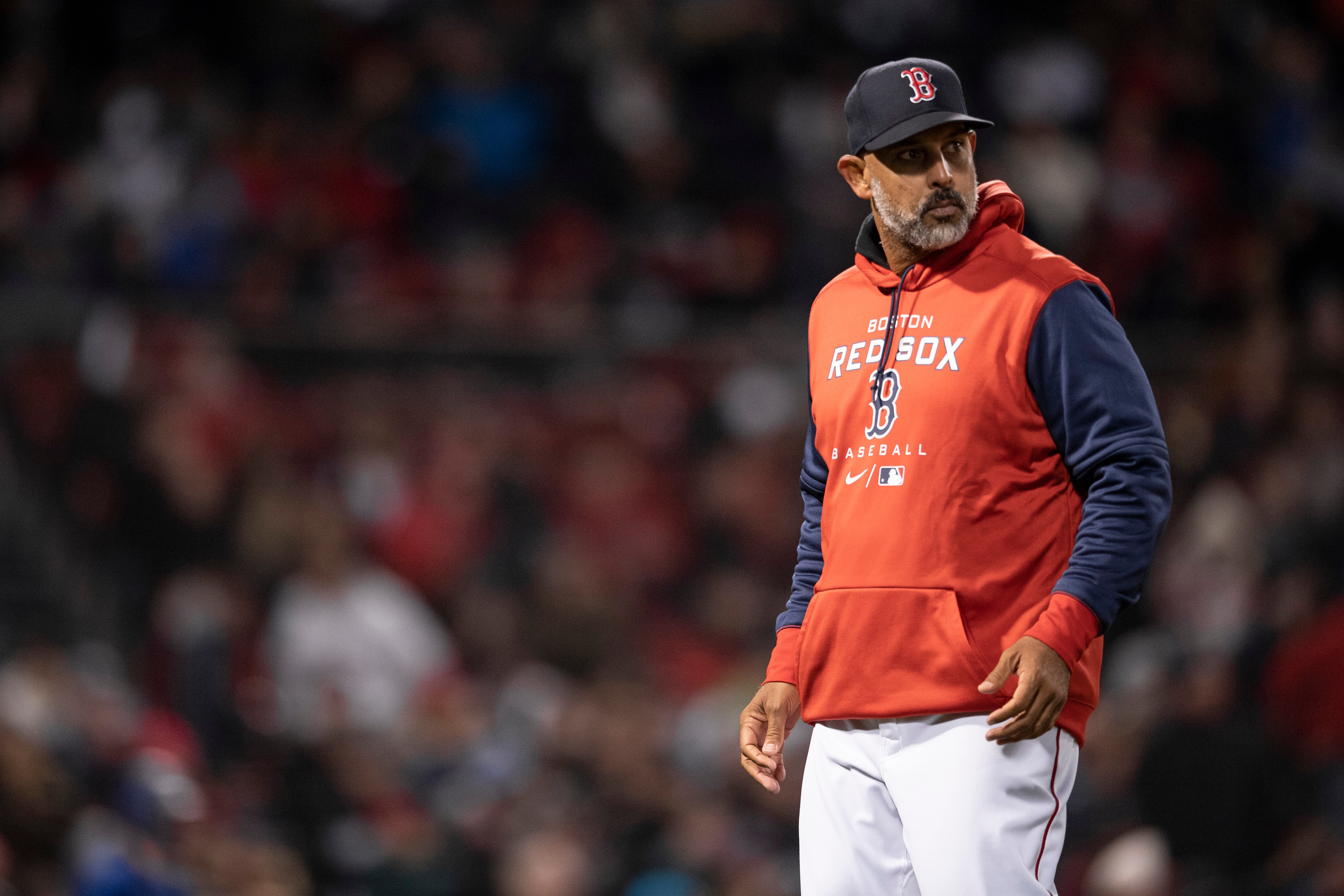 BOSTON, MA - APRIL 19: Manager Alex Cora #13 of the Boston Red Sox walks to the dugout after a pitching change during the fifth inning against the Toronto Blue Jays on April 19, 2022 at Fenway Park in Boston, Massachusetts. (Photo by Maddie Malhotra/Boston Red Sox/Getty Images)