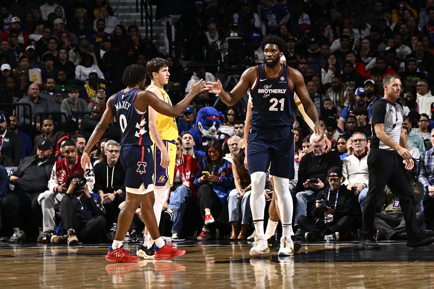 PHILADELPHIA, PA - NOVEMBER 27: Joel Embiid #21 and Tyrese Maxey #0 of the Philadelphia 76ers high five during the game against the Los Angeles Lakers on November 27, 2023 at the Wells Fargo Center in Philadelphia, Pennsylvania NOTE TO USER: User expressly acknowledges and agrees that, by downloading and/or using this Photograph, user is consenting to the terms and conditions of the Getty Images License Agreement. Mandatory Copyright Notice: Copyright 2023 NBAE (Photo by David Dow/NBAE via Getty Images)