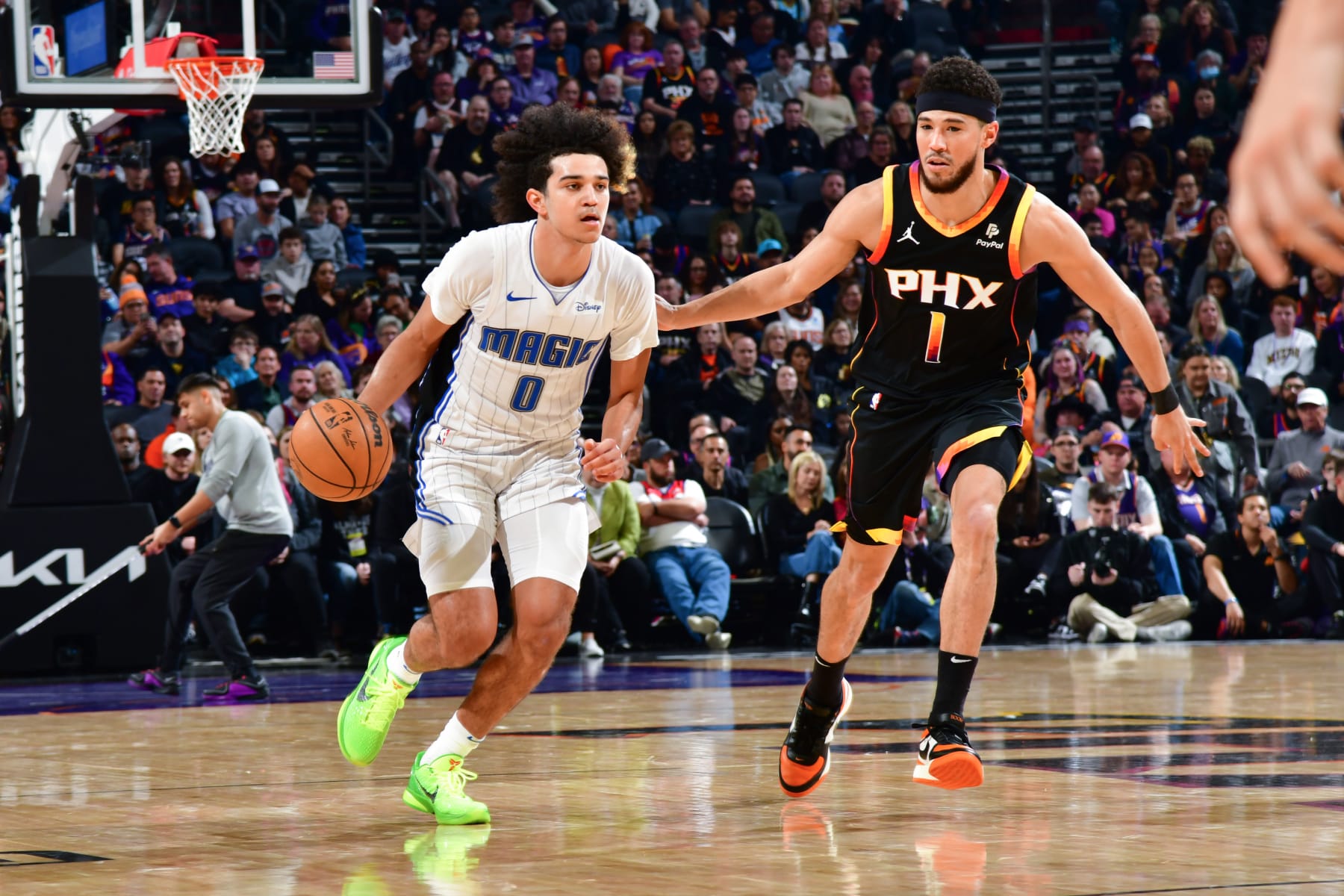 PHOENIX, AZ - DECEMBER 31: Anthony Black #0 of the Orlando Magic dribbles the ball during the game against the Phoenix Suns on December 31, 2023 at Footprint Center in Phoenix, Arizona. NOTE TO USER: User expressly acknowledges and agrees that, by downloading and or using this photograph, user is consenting to the terms and conditions of the Getty Images License Agreement. Mandatory Copyright Notice: Copyright 2023 NBAE (Photo by Kate Frese/NBAE via Getty Images)