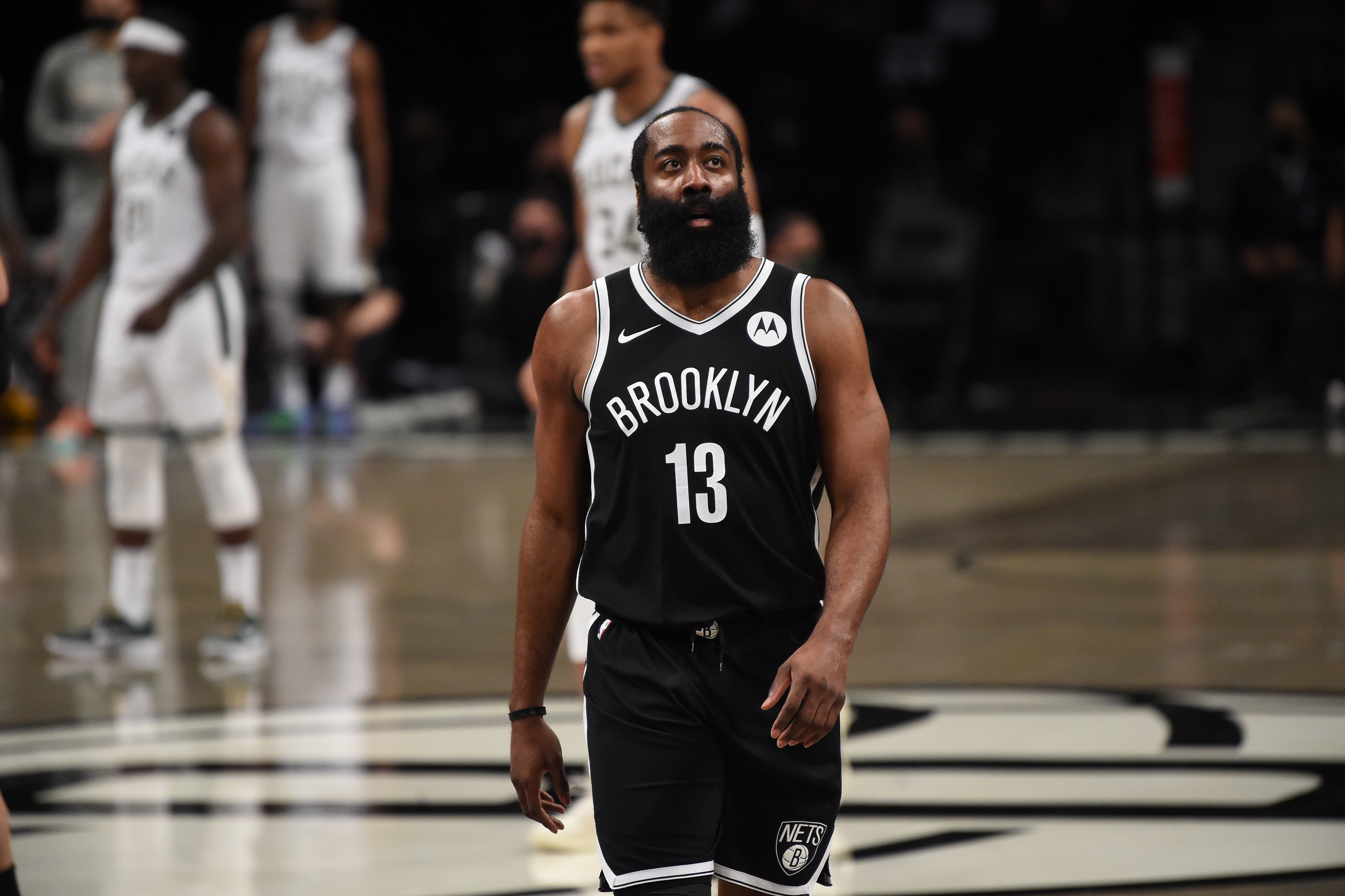 BROOKLYN, NY - JUNE 19: James Harden #13 of the Brooklyn Nets looks on during a game against the Milwaukee Bucks during Round 2, Game 7 on June 19, 2021 at Barclays Center in Brooklyn, New York. NOTE TO USER: User expressly acknowledges and agrees that, by downloading and/or using this Photograph, user is consenting to the terms and conditions of the Getty Images License Agreement. Mandatory Copyright Notice: Copyright 2021 NBAE (Photo by David Dow/NBAE via Getty Images)
