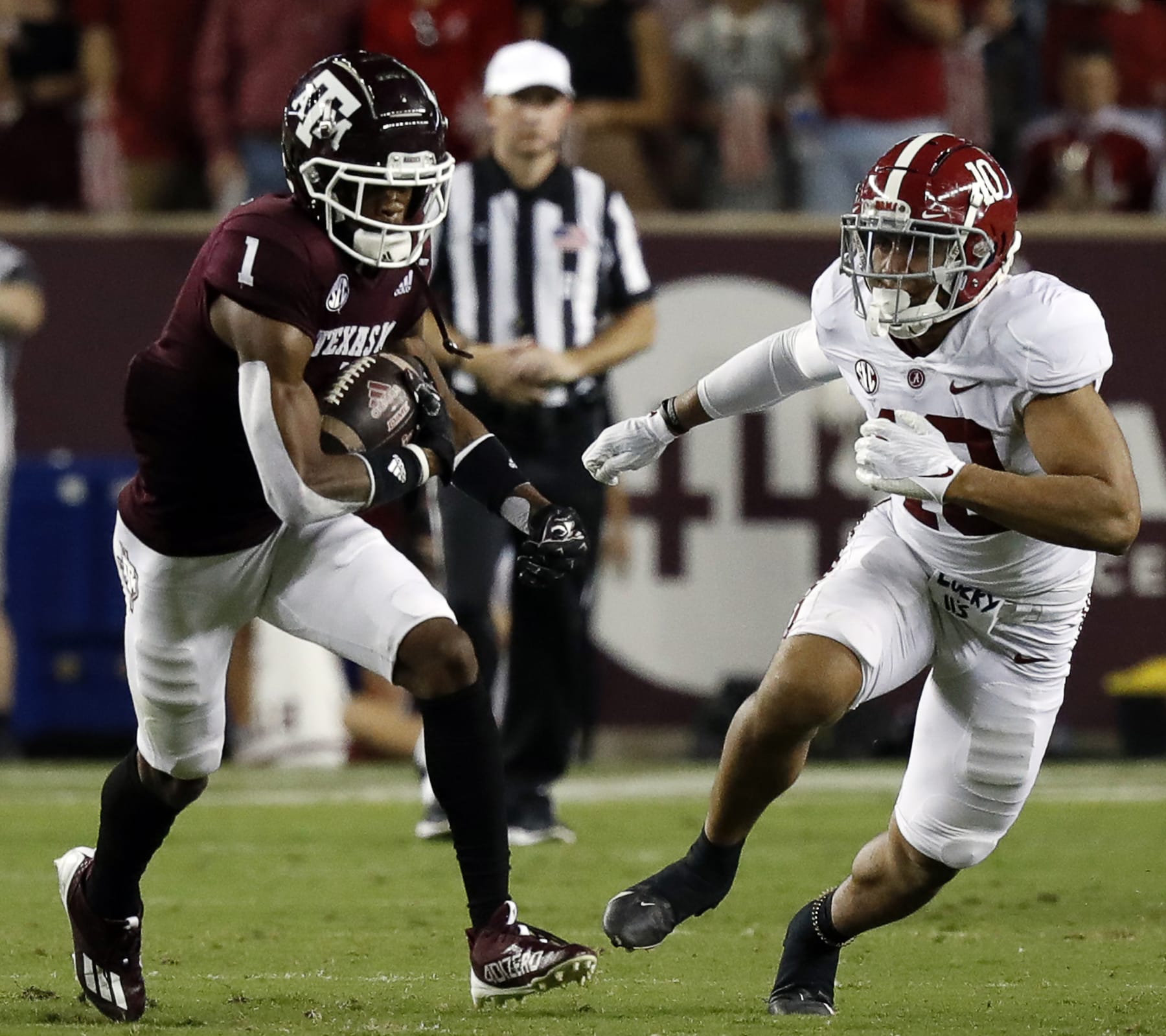 COLLEGE STATION, TEXAS - OCTOBER 09: Demond Demas #1 of the Texas A&M Aggies runs with the ball as Henry To'oTo'o #10 of the Alabama Crimson Tide pursues at Kyle Field on October 09, 2021 in College Station, Texas. (Photo by Bob Levey/Getty Images)