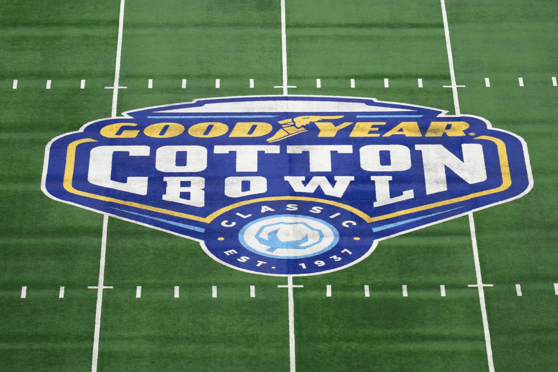 ARLINGTON, TX - DECEMBER 31: A detail view of the Goodyear Cotton Bowl logo is seen at the 50 yard marker of the field during the CFP Semifinal Goodyear Cotton Bowl game between the Cincinnati Bearcats and the Alabama Crimson Tide on December 31, 2021 at AT&T Stadium in Arlington, TX. (Photo by Robin Alam/Icon Sportswire via Getty Images)