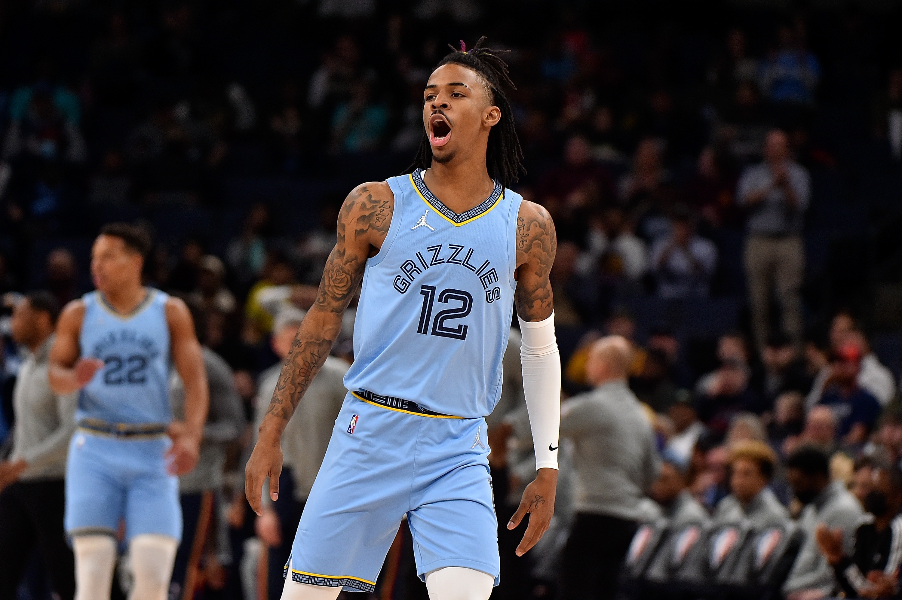 MEMPHIS, TENNESSEE - MARCH 08: Ja Morant #12 of the Memphis Grizzlies reacts during the first half against the New Orleans Pelicans at FedExForum on March 08, 2022 in Memphis, Tennessee. NOTE TO USER: User expressly acknowledges and agrees that , by downloading and or using this photograph, User is consenting to the terms and conditions of the Getty Images License Agreement.  (Photo by Justin Ford/Getty Images)