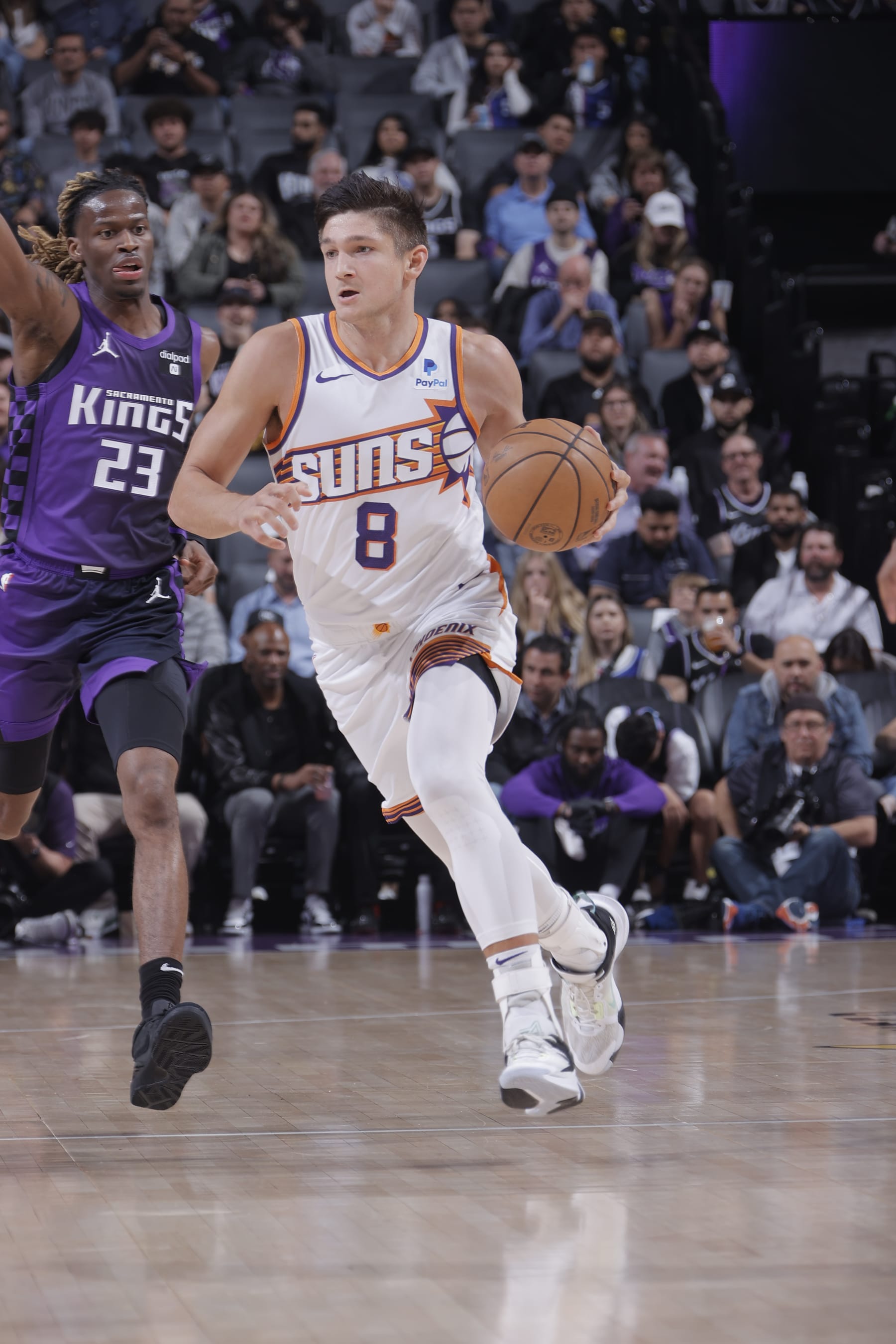 SACRAMENTO, CA - APRIL 12: Grayson Allen #8 of the Phoenix Suns dribbles the ball during the game against the Sacramento Kings on April 12, 2024 at Golden 1 Center in Sacramento, California. NOTE TO USER: User expressly acknowledges and agrees that, by downloading and or using this Photograph, user is consenting to the terms and conditions of the Getty Images License Agreement. Mandatory Copyright Notice: Copyright 2024 NBAE (Photo by Rocky Widner/NBAE via Getty Images)