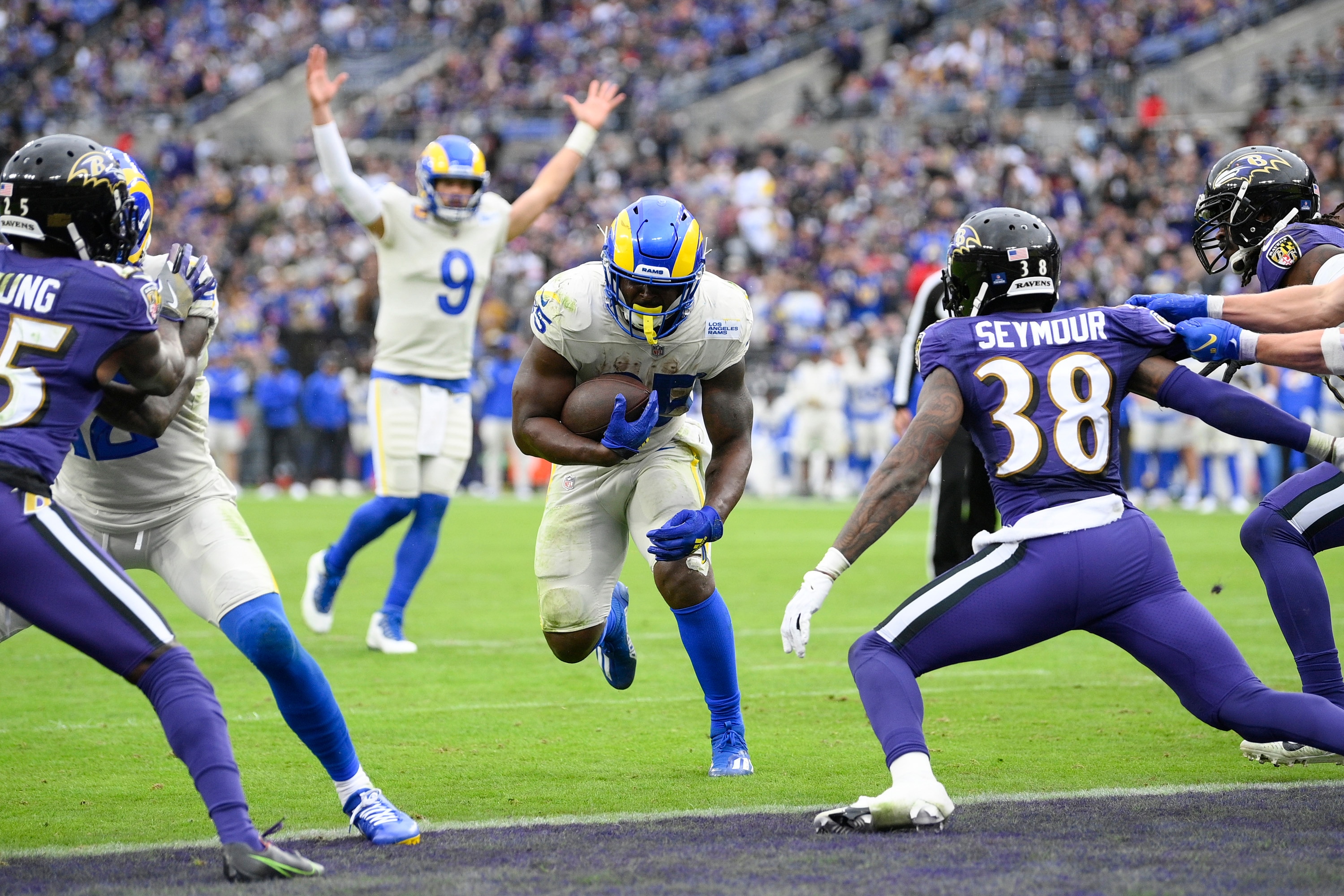 Los Angeles Rams running back Sony Michel, center, runs for a touchdown as quarterback Matthew Stafford (9) reacts during the second half of an NFL football game against the Baltimore Ravens, Sunday, Jan. 2, 2022, in Baltimore. (AP Photo/Nick Wass)