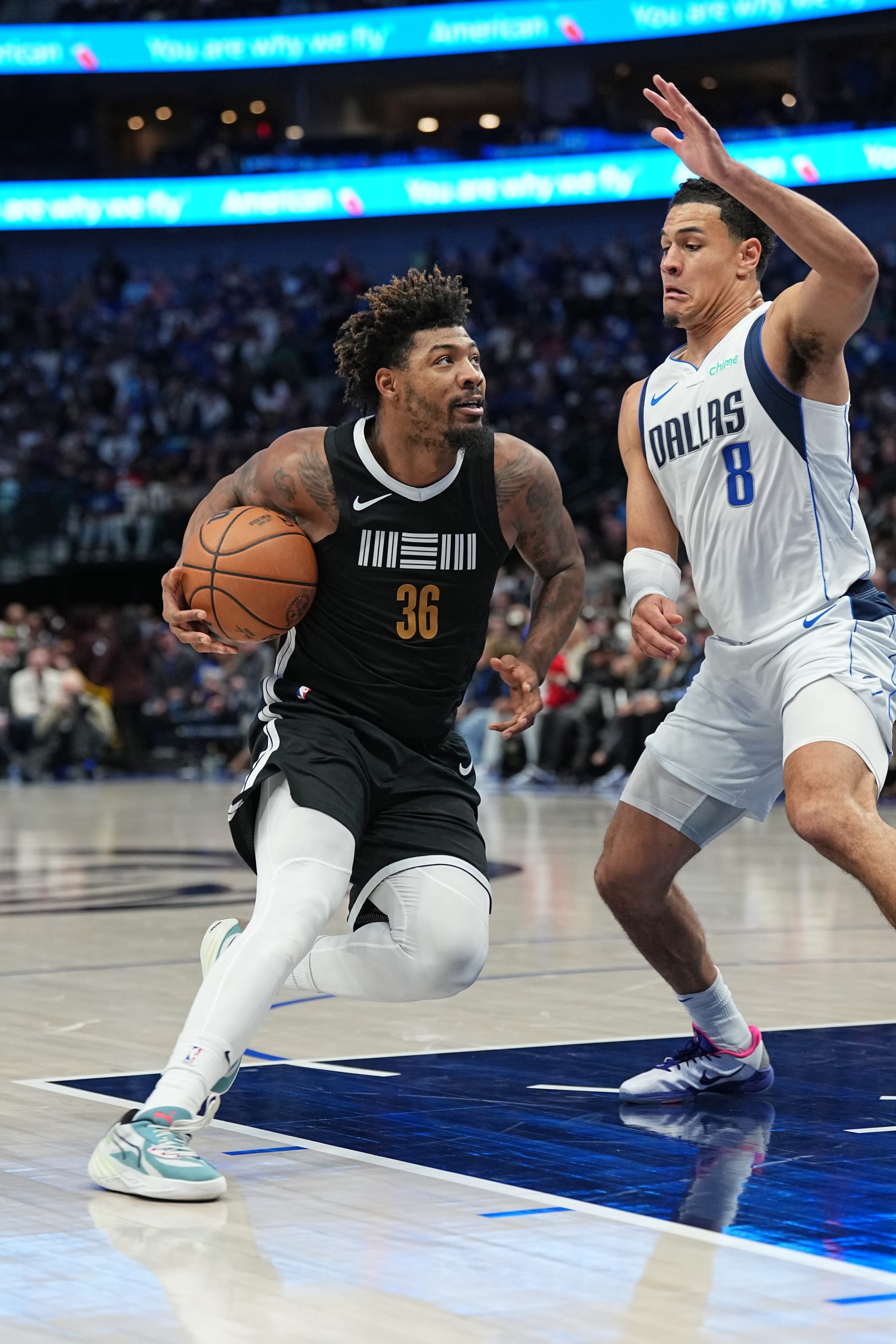 DALLAS, TX - JANUARY 9: Marcus Smart #36 of the Memphis Grizzlies drives to the basket during the game against the Dallas Mavericks on January 9, 2024 at the American Airlines Center in Dallas, Texas. NOTE TO USER: User expressly acknowledges and agrees that, by downloading and or using this photograph, User is consenting to the terms and conditions of the Getty Images License Agreement. Mandatory Copyright Notice: Copyright 2024 NBAE (Photo by Glenn James/NBAE via Getty Images)
