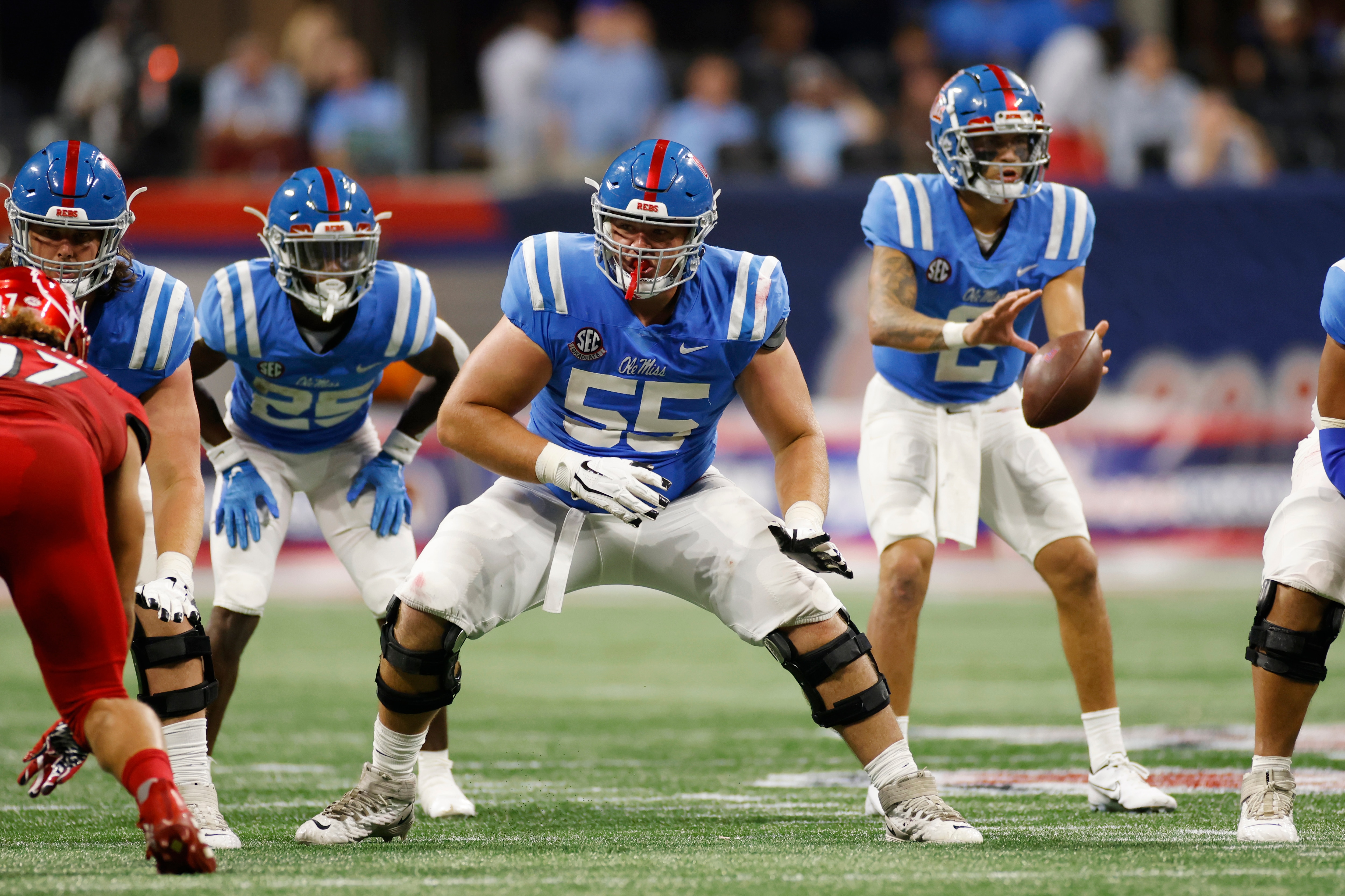 ATLANTA, GA - SEPTEMBER 06: Mississippi Rebels offensive lineman Ben Brown (55) blocks during the Chick-Fil-A Kickoff game against the Louisville Cardinals on Sept. 6, 2021 at Mercedes-Benz Stadium in Atlanta, Georgia. (Photo by Joe Robbins/Icon Sportswire via Getty Images)