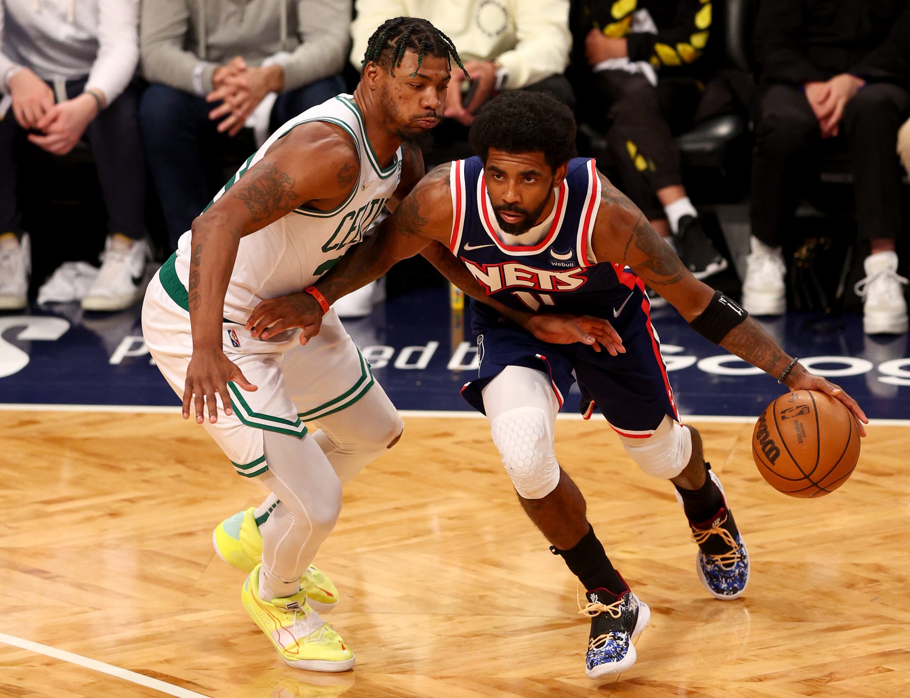 NEW YORK, NEW YORK - APRIL 25: Kyrie Irving #11 of the Brooklyn Nets tries to get around Marcus Smart #36 of the Boston Celtics during Game Four of the Eastern Conference First Round Playoffs at Barclays Center on April 25, 2022 in the Brooklyn borough of New York City. The Boston Celtics defeated the Brooklyn Nets 116-112. NOTE TO USER: User expressly acknowledges and agrees that, by downloading and or using this photograph, User is consenting to the terms and conditions of the Getty Images License Agreement. (Photo by Elsa/Getty Images)