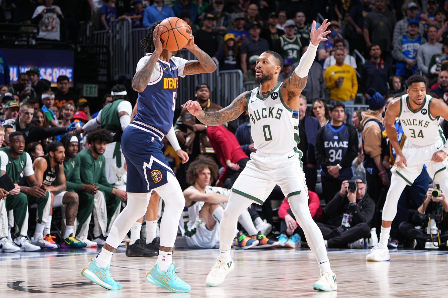 DENVER, CO - JANUARY 29: Damian Lillard #0 of the Milwaukee Bucks plays defense during the game against the Denver Nuggets on January 29, 2024 at the Ball Arena in Denver, Colorado. NOTE TO USER: User expressly acknowledges and agrees that, by downloading and/or using this Photograph, user is consenting to the terms and conditions of the Getty Images License Agreement. Mandatory Copyright Notice: Copyright 2024 NBAE (Photo by Garrett Ellwood/NBAE via Getty Images)
