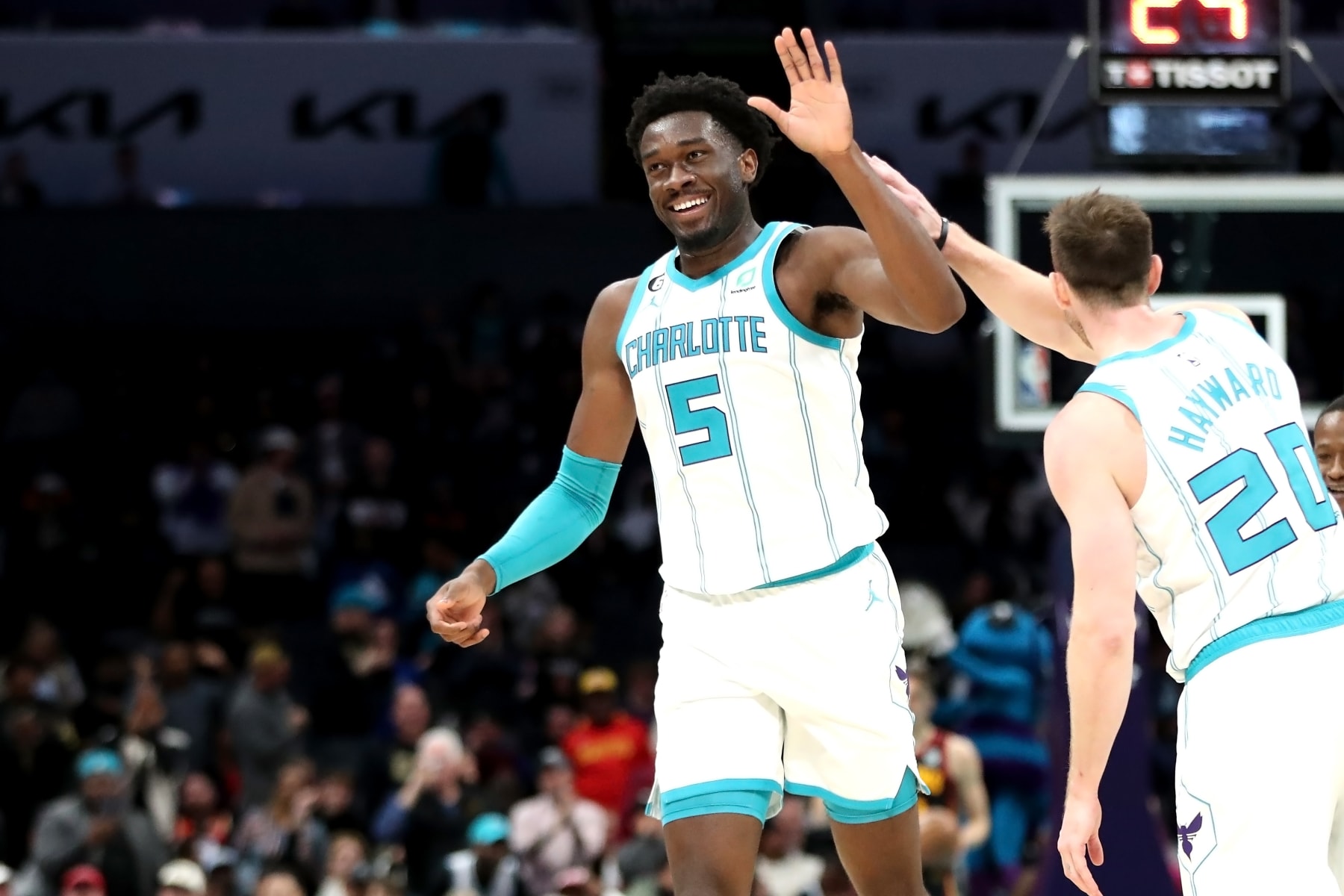 CHARLOTTE, NORTH CAROLINA - FEBRUARY 13: Mark Williams #5 of the Charlotte Hornets celebrates with Gordon Hayward #20 after making a basket during the fourth period of a basketball game against the Atlanta Hawks at Spectrum Center on February 13, 2023 in Charlotte, North Carolina. NOTE TO USER: User expressly acknowledges and agrees that, by downloading and or using this photograph, User is consenting to the terms and conditions of the Getty Images License Agreement. (Photo by David Jensen/Getty Images)