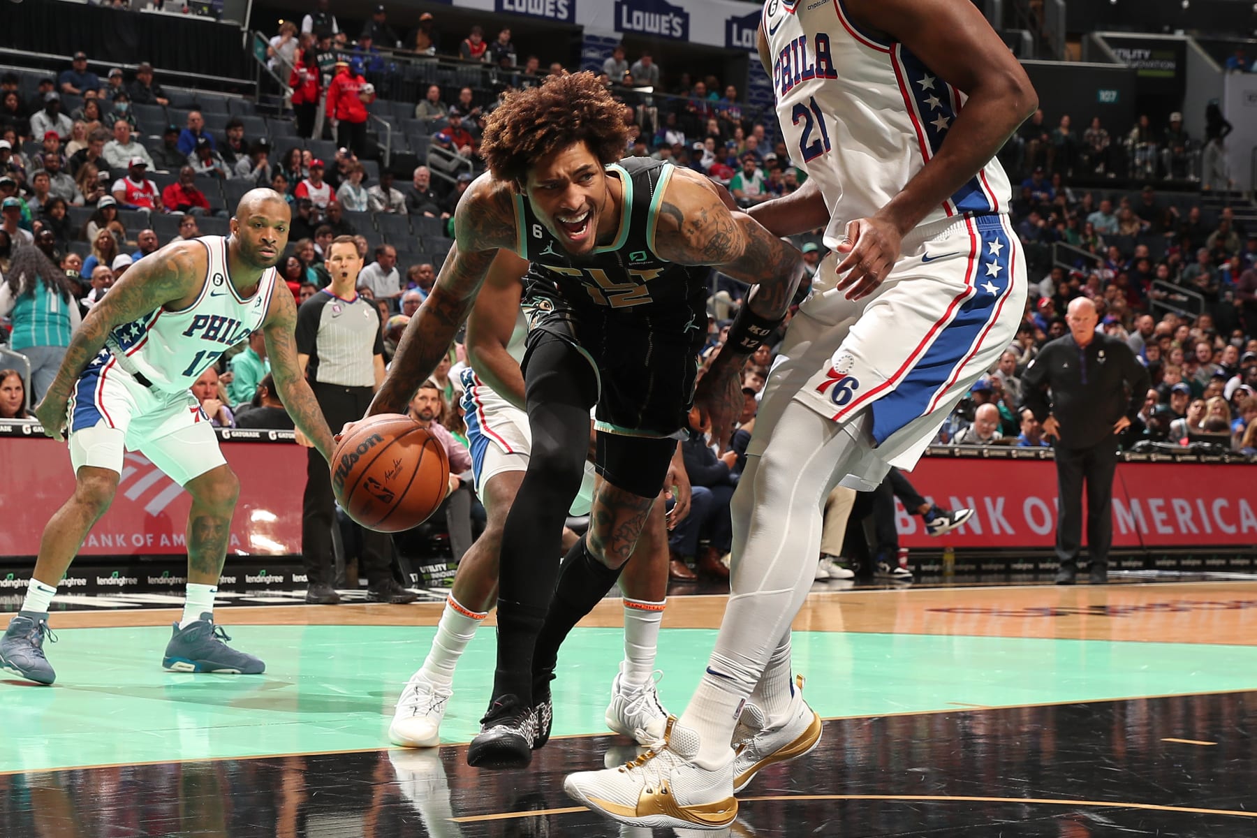 CHARLOTTE, NC - MARCH 17: Kelly Oubre Jr. #12 of the Charlotte Hornets drives to the basket during the game against the Philadelphia 76ers on March 17, 2023 at Spectrum Center in Charlotte, North Carolina. NOTE TO USER: User expressly acknowledges and agrees that, by downloading and or using this photograph, User is consenting to the terms and conditions of the Getty Images License Agreement. Mandatory Copyright Notice: Copyright 2023 NBAE (Photo by Kent Smith/NBAE via Getty Images)