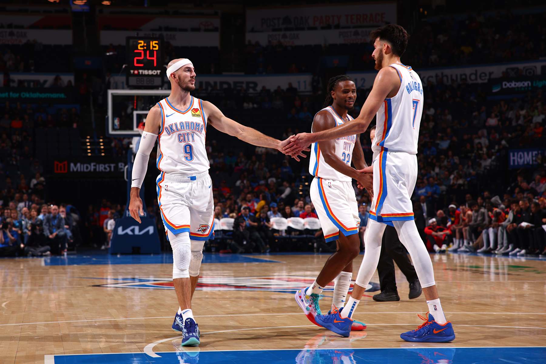 OKLAHOMA CITY, OK - OCTOBER 17: Alex Caruso #9 and Chet Holmgren #7 of the Oklahoma City Thunder high five during the game against the Atlanta Hawks on October 17, 2024 at Paycom Arena in Oklahoma City, Oklahoma. NOTE TO USER: User expressly acknowledges and agrees that, by downloading and or using this photograph, User is consenting to the terms and conditions of the Getty Images License Agreement. Mandatory Copyright Notice: Copyright 2024 NBAE (Photo by Zach Beeker/NBAE via Getty Images)