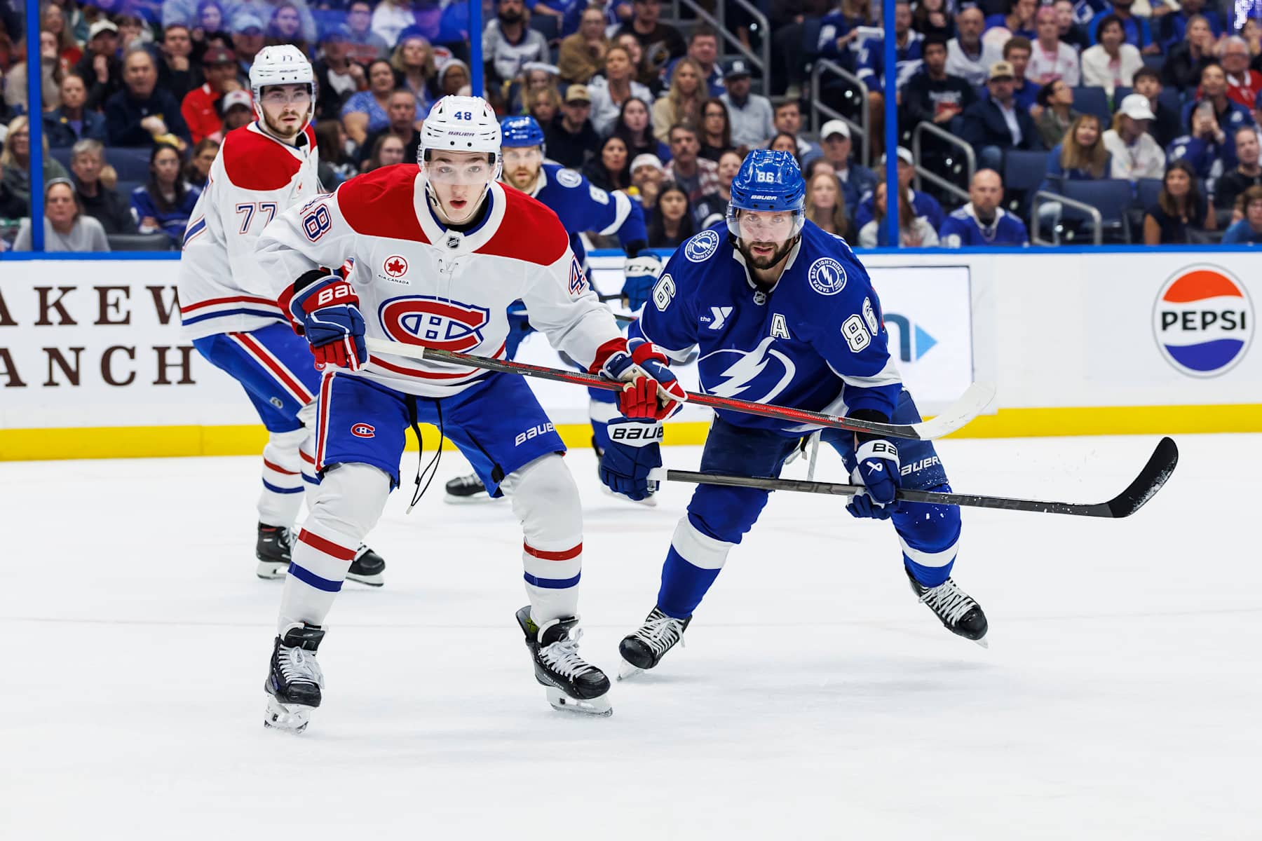TAMPA, FL - DECEMBER 29: Nikita Kucherov #86 of the Tampa Bay Lightning skates against Lane Hutson #48 of the Montreal Canadiens at Amalie Arena on December 29, 2024 in Tampa, Florida. (Photo by Mark LoMoglio/NHLI via Getty Images)
