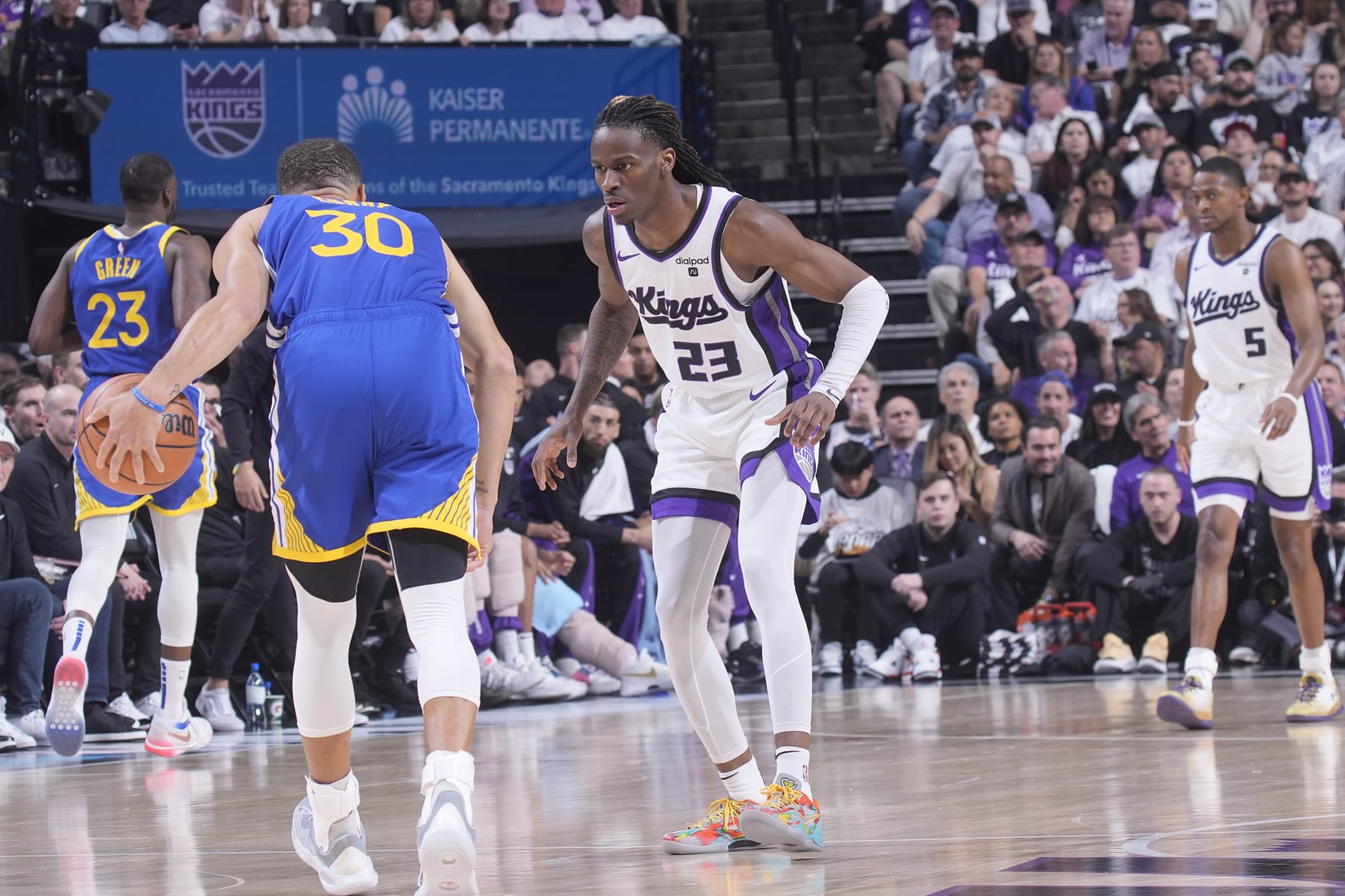 SACRAMENTO, CA - APRIL 16: Keon Ellis #23 of the Sacramento Kings defends against Stephen Curry #30 of the Golden State Warriors during the game during the 2024 Play-In Tournament on April 16, 2024 at Golden 1 Center in Sacramento, California. NOTE TO USER: User expressly acknowledges and agrees that, by downloading and or using this photograph, User is consenting to the terms and conditions of the Getty Images Agreement. Mandatory Copyright Notice: Copyright 2024 NBAE (Photo by Rocky Widner/NBAE via Getty Images)