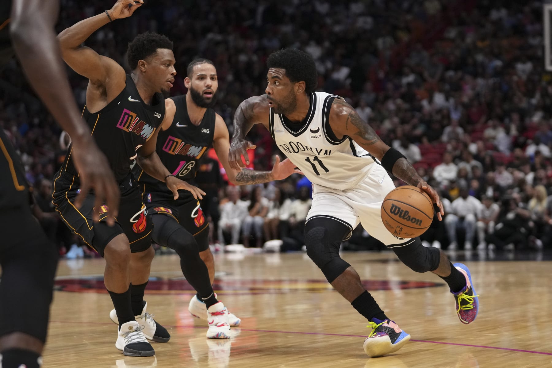 MIAMI, FLORIDA - MARCH 26: Kyrie Irving #11 of the Brooklyn Nets drives to the basket during the first half against the Miami Heat at FTX Arena on March 26, 2022 in Miami, Florida. NOTE TO USER: User expressly acknowledges and agrees that,  by downloading and or using this photograph,  User is consenting to the terms and conditions of the Getty Images License Agreement. (Photo by Eric Espada/Getty Images) (Photo by Eric Espada/Getty Images)