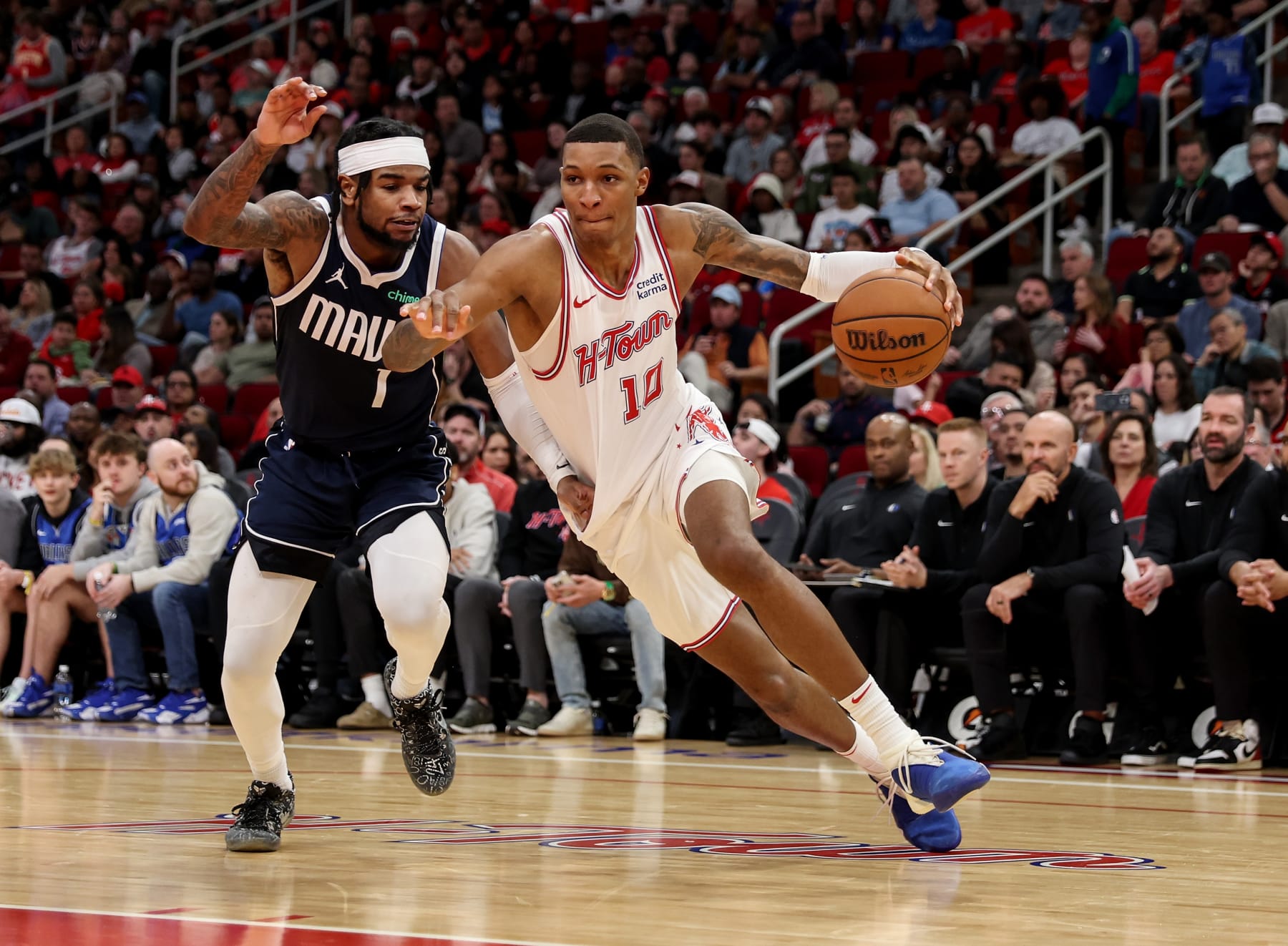 HOUSTON, TEXAS - DECEMBER 22: Jabari Smith Jr. #10 of the Houston Rockets drives to the basket while defended by Jaden Hardy #1 of the Dallas Mavericks in the second half at Toyota Center on December 22, 2023 in Houston, Texas.   NOTE TO USER: User expressly acknowledges and agrees that, by downloading and or using this photograph, User is consenting to the terms and conditions of the Getty Images License Agreement. (Photo by Tim Warner/Getty Images)