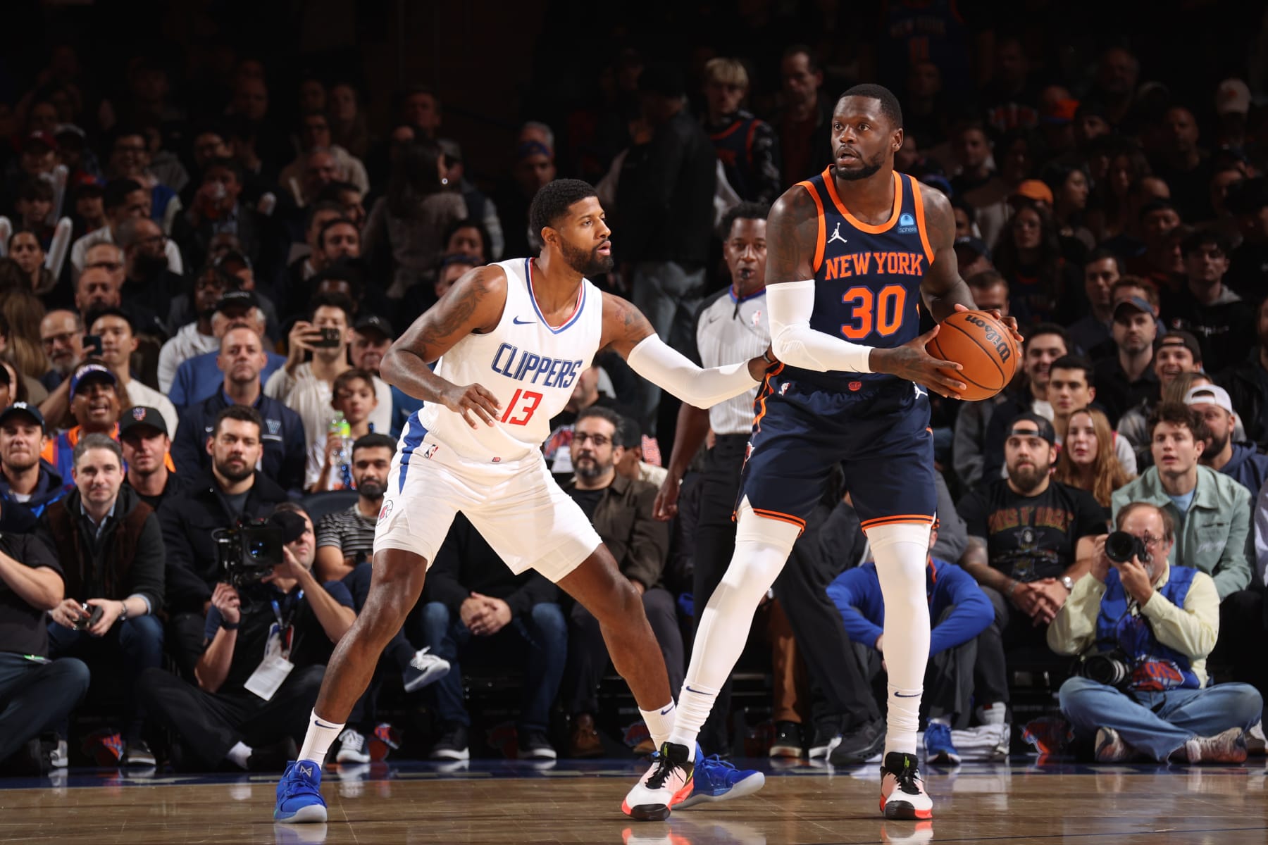 NEW YORK, NY - NOVEMBER 6: Paul George #13 of the LA Clippers plays defense against Julius Randle #30 of the New York Knicks on November 6, 2023 at Madison Square Garden in New York, NY. NOTE TO USER: User expressly acknowledges and agrees that, by downloading and or using this Photograph, user is consenting to the terms and conditions of the Getty Images License Agreement. Mandatory Copyright Notice: Copyright 2023 NBAE (Photo by Stephen Gosling/NBAE via Getty Images)