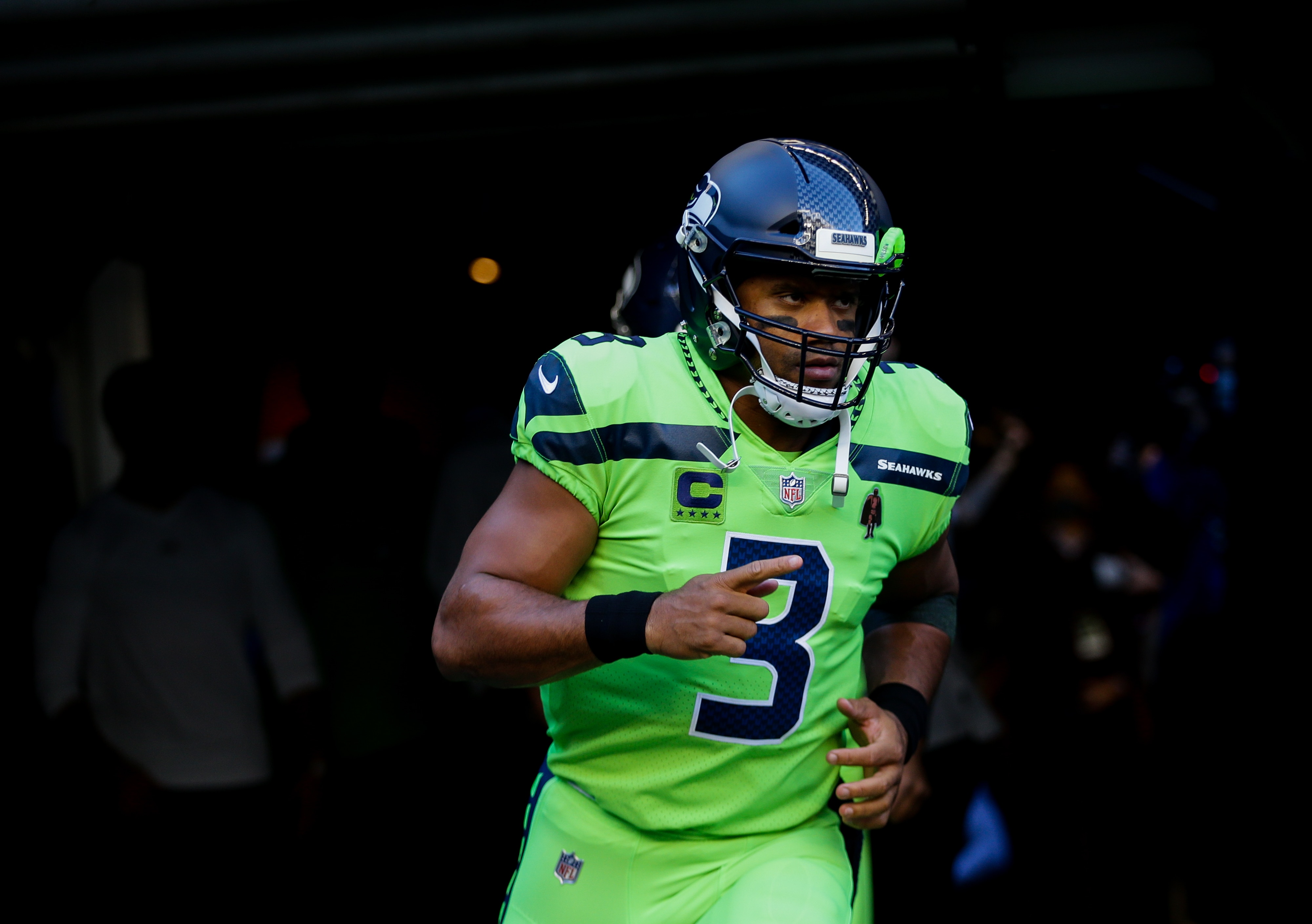 SEATTLE, WA - OCTOBER 07:  Quarterback Russell Wilson #3 of the Seattle Seahawks runs out for the game against the Los Angeles Rams at Lumen Field on October 7, 2021 in Seattle, Washington. (Photo by Lindsey Wasson/Getty Images)