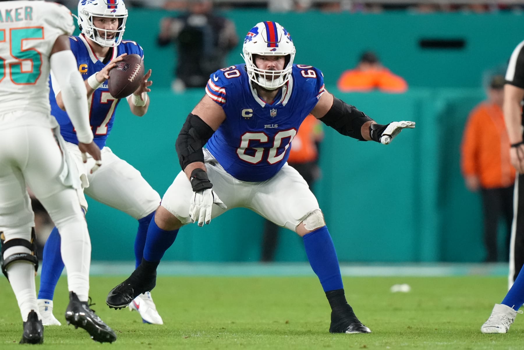 MIAMI GARDENS, FL - JANUARY 07: Buffalo Bills center Mitch Morse (60) protects the pocket during the game between the Buffalo Bills and the Miami Dolphins on Sunday, January 7, 2024 at Hard Rock Stadium, Miami Gardens, Fla. (Photo by Peter Joneleit/Icon Sportswire via Getty Images)