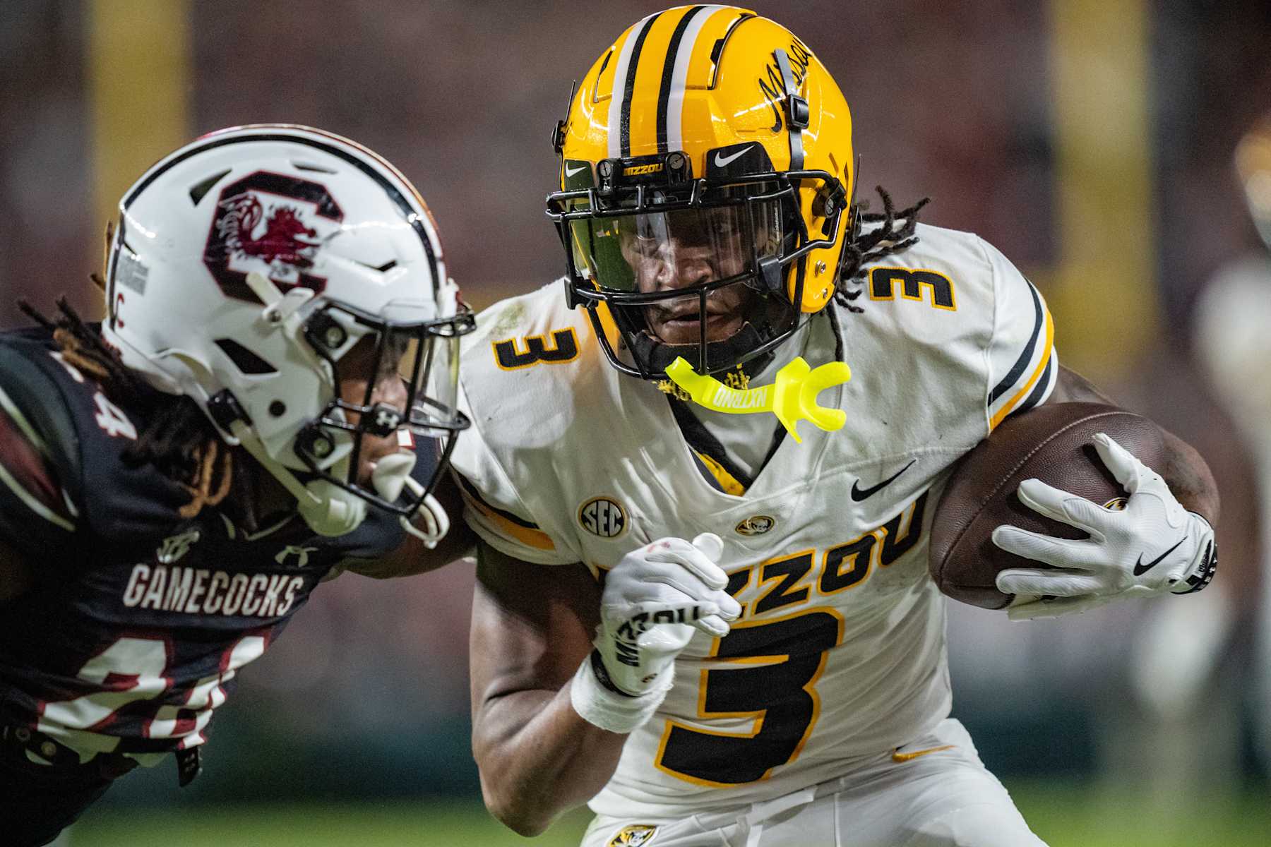 COLUMBIA, SOUTH CAROLINA - NOVEMBER 16: Luther Burden III #3 of the Missouri Tigers makes a catch for a touchdown while covered by Jalon Kilgore #24 of the South Carolina Gamecocks in the fourth quarter during their game at Williams-Brice Stadium on November 16, 2024 in Columbia, South Carolina. (Photo by Jacob Kupferman/Getty Images)