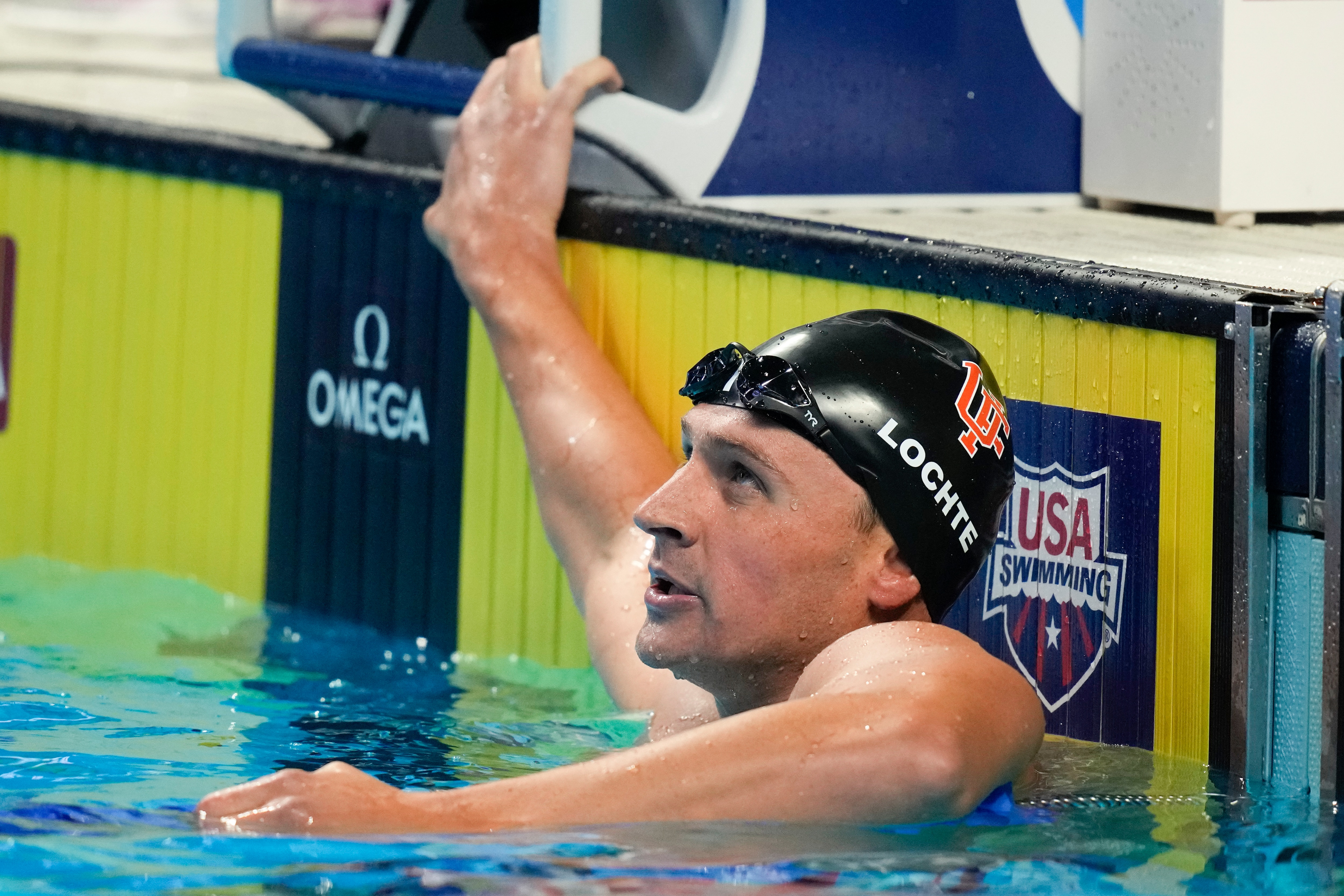 Ryan Lochte checks his time after competing in a men's 200-meter individual medley semifinal heat during wave 2 of the U.S. Olympic Swim Trials on Thursday, June 17, 2021, in Omaha, Neb. (AP Photo/Charlie Neibergall)