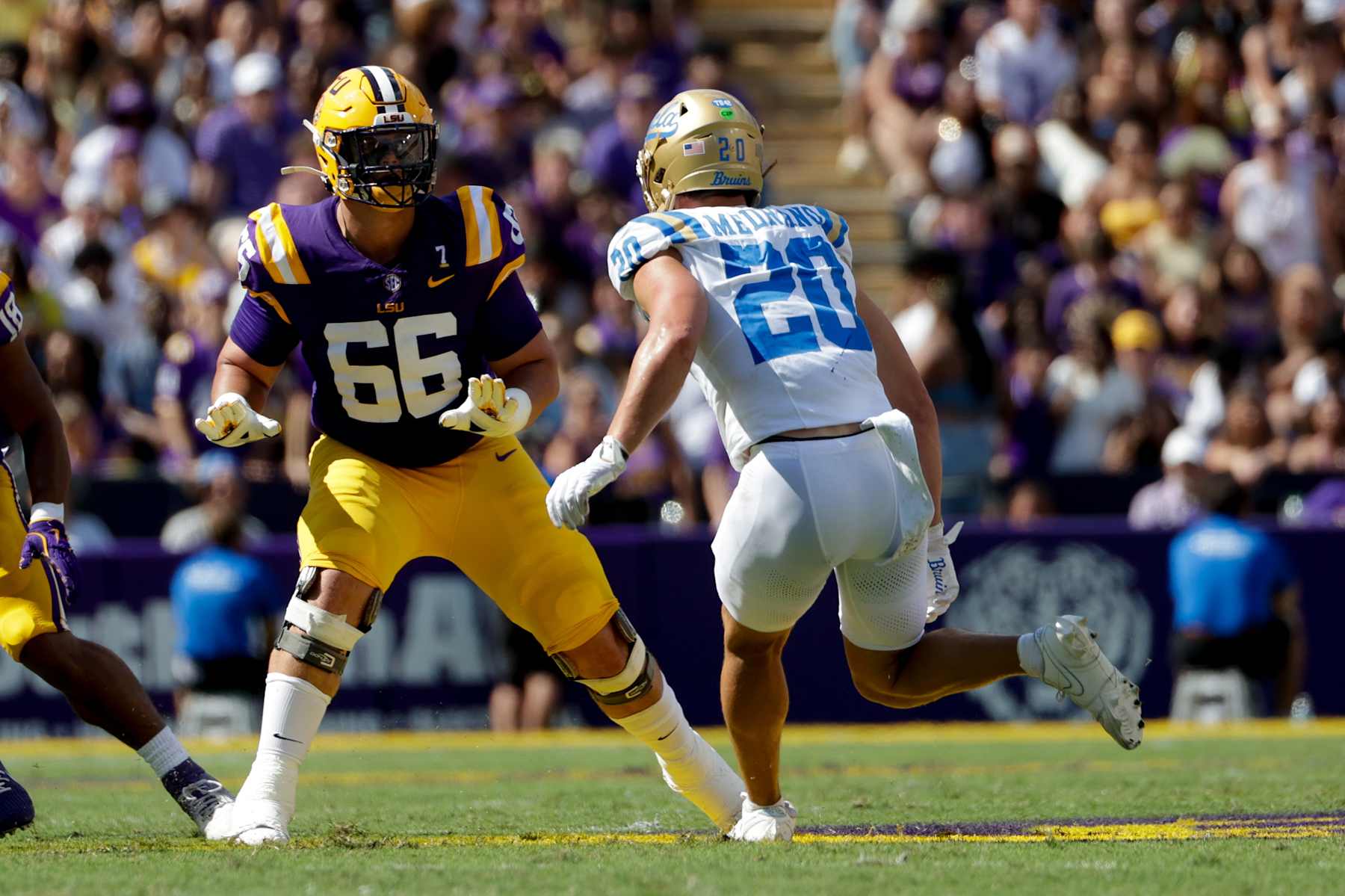 BATON ROUGE, LOUISIANA - SEPTEMBER 21: Will Campbell #66 of the LSU Tigers blocks against Kain Medrano #20 of the UCLA Bruins during the first half at Tiger Stadium on September 21, 2024 in Baton Rouge, Louisiana. (Photo by Derick E. Hingle/Getty Images)