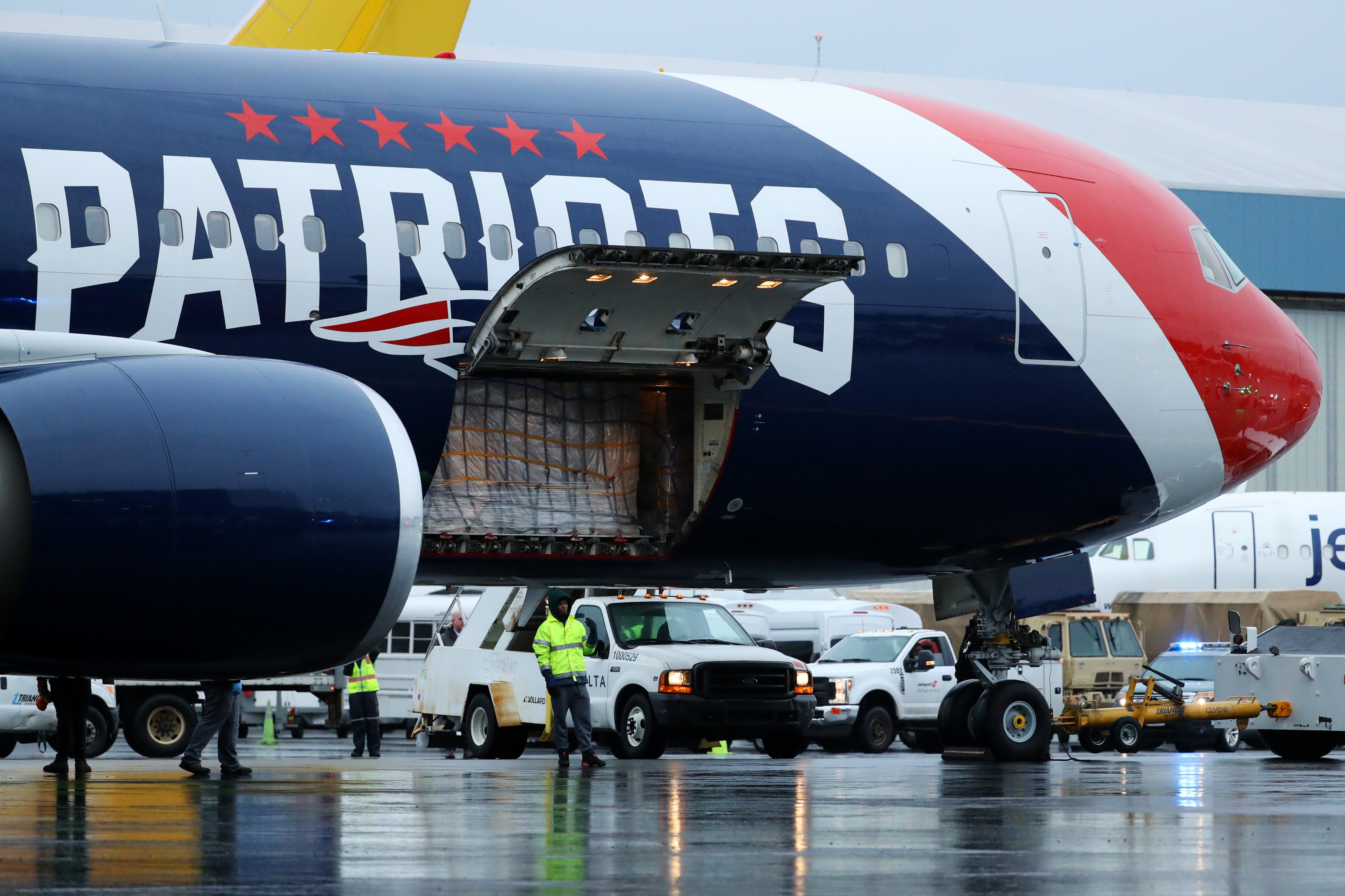 BOSTON, MASSACHUSETTS - APRIL 02: The New England Patriots plane delivers N95 masks from Shenzhen, China to Logan International Airport to slow the spread of the coronavirus (COVID-19) outbreak on April 02, 2020 in Boston, Massachusetts. New England Patriots owner Robert Kraft and his son Patriots President Jonathan Kraft partnered with Massachusetts Governor Charlie Baker to ship the masks which will be split between Massachusetts and New York.  (Photo by Maddie Meyer/Getty Images)