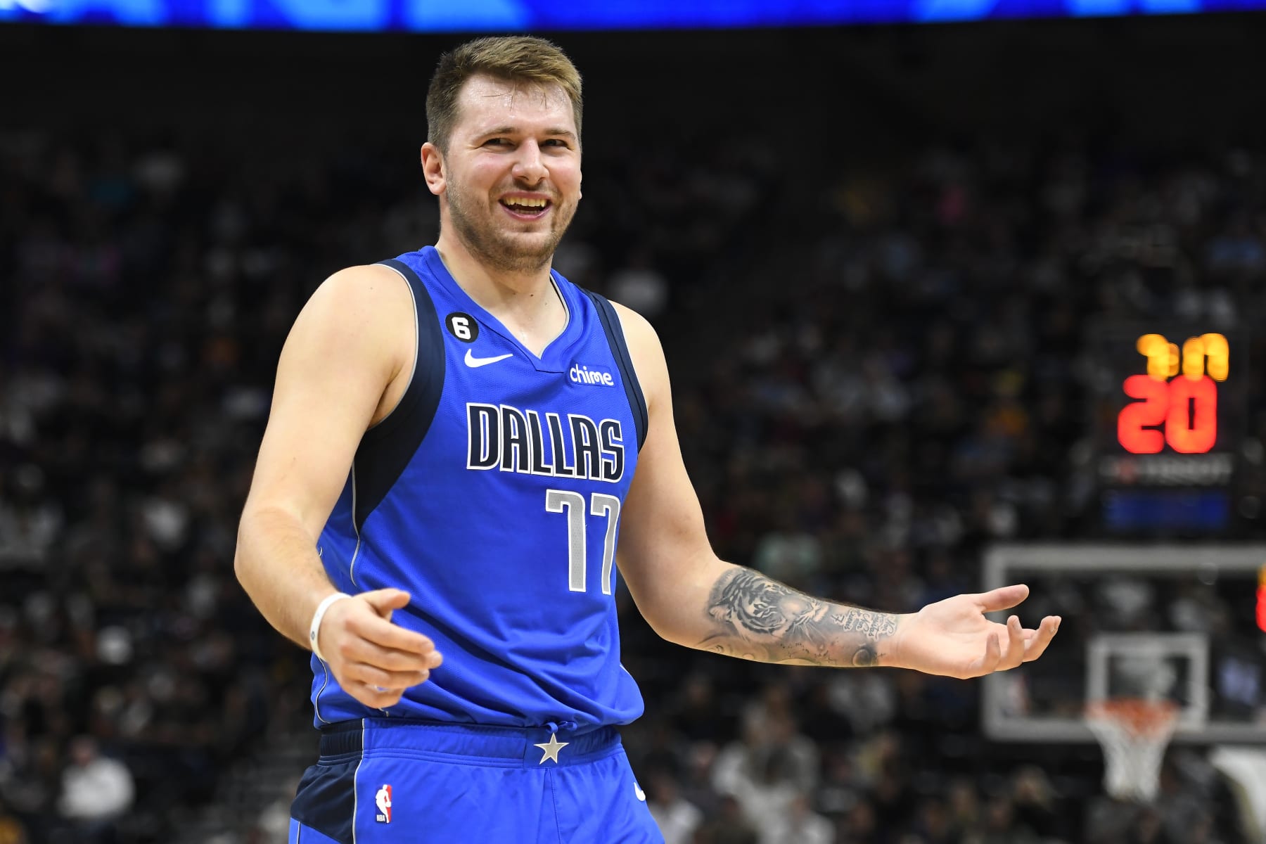SALT LAKE CITY, UTAH - OCTOBER 14: Luka Doncic #77 of the Dallas Mavericks reacts to a play during a preseason game against the Utah Jazz at Vivint Arena on October 14, 2022 in Salt Lake City, Utah. NOTE TO USER: User expressly acknowledges and agrees that, by downloading and or using this photograph, User is consenting to the terms and conditions of the Getty Images License Agreement. (Photo by Alex Goodlett/Getty Images)
