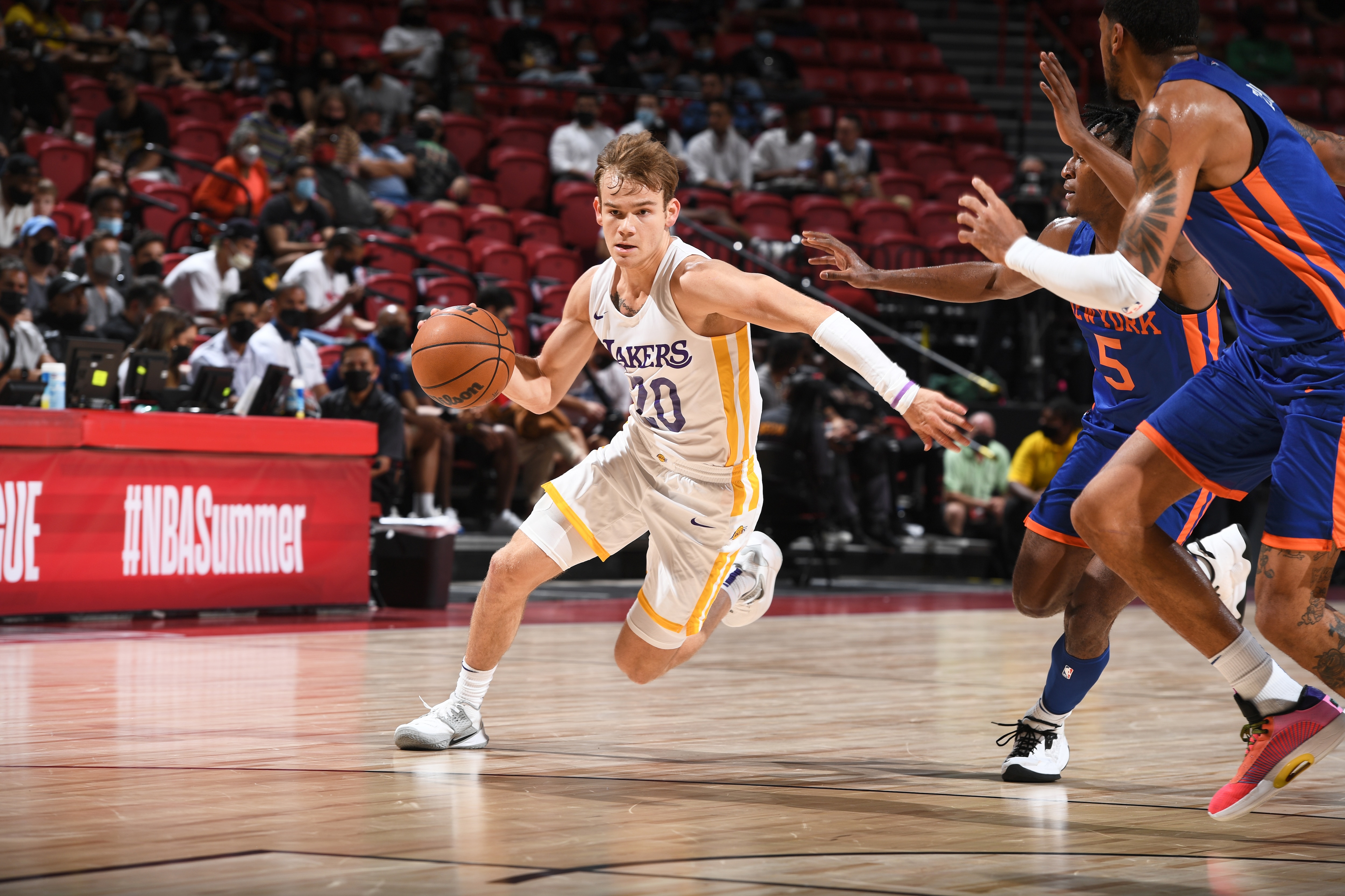 LAS VEGAS, NV - AUGUST 11: Mac McClung #20 of the Los Angeles Lakers dribbles during the game against the New York Knicks during the 2021 Las Vegas Summer League on August 11, 2021 at the Thomas & Mack Center in Las Vegas, Nevada. NOTE TO USER: User expressly acknowledges and agrees that, by downloading and/or using this Photograph, user is consenting to the terms and conditions of the Getty Images License Agreement. Mandatory Copyright Notice: Copyright 2021 NBAE (Photo by Garrett Ellwood/NBAE via Getty Images)