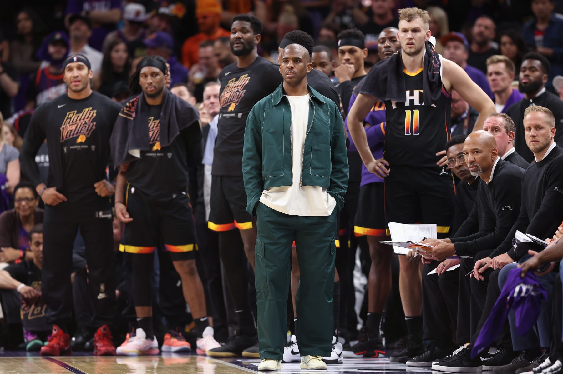 PHOENIX, ARIZONA - MAY 05: (L-R) Ish Wainright #12, Josh Okogie #2, Deandre Ayton #22, Chris Paul #3, Jock Landale #11, head coach Monty Williams and associate coach Kevin Young of the Phoenix Suns look on during Game Three of the NBA Western Conference Semifinals at Footprint Center on May 05, 2023 in Phoenix, Arizona.  The Suns defeated the Nuggets 121-114. NOTE TO USER: User expressly acknowledges and agrees that, by downloading and or using this photograph, User is consenting to the terms and conditions of the Getty Images License Agreement.  (Photo by Christian Petersen/Getty Images)