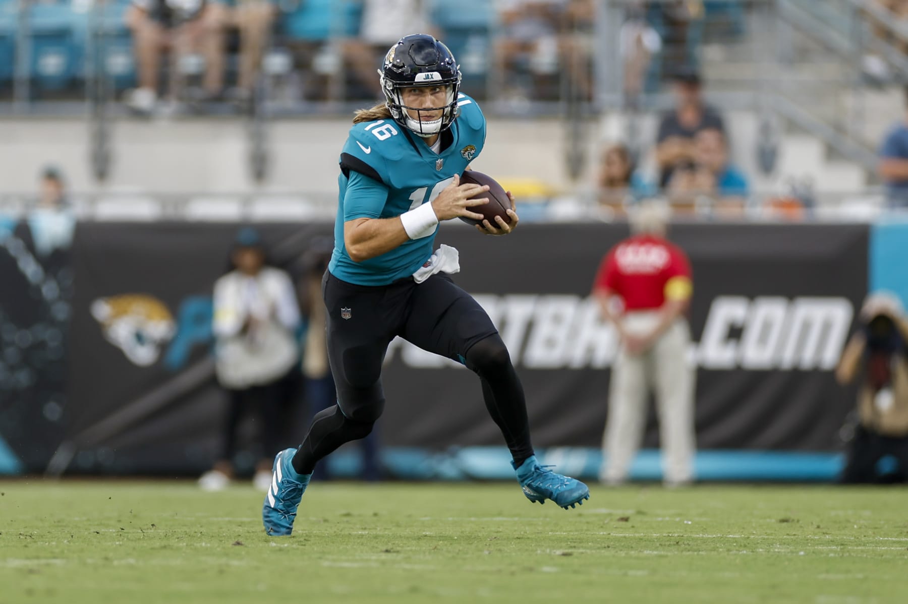JACKSONVILLE, FL - AUGUST 12: Jacksonville Jaguars quarterback Trevor Lawrence (16) runs with the ball during the game between the Cleveland Browns and the Jacksonville Jaguars on August 12, 2022 at TIAA Bank Field in Jacksonville, Fl. (Photo by David Rosenblum/Icon Sportswire via Getty Images)