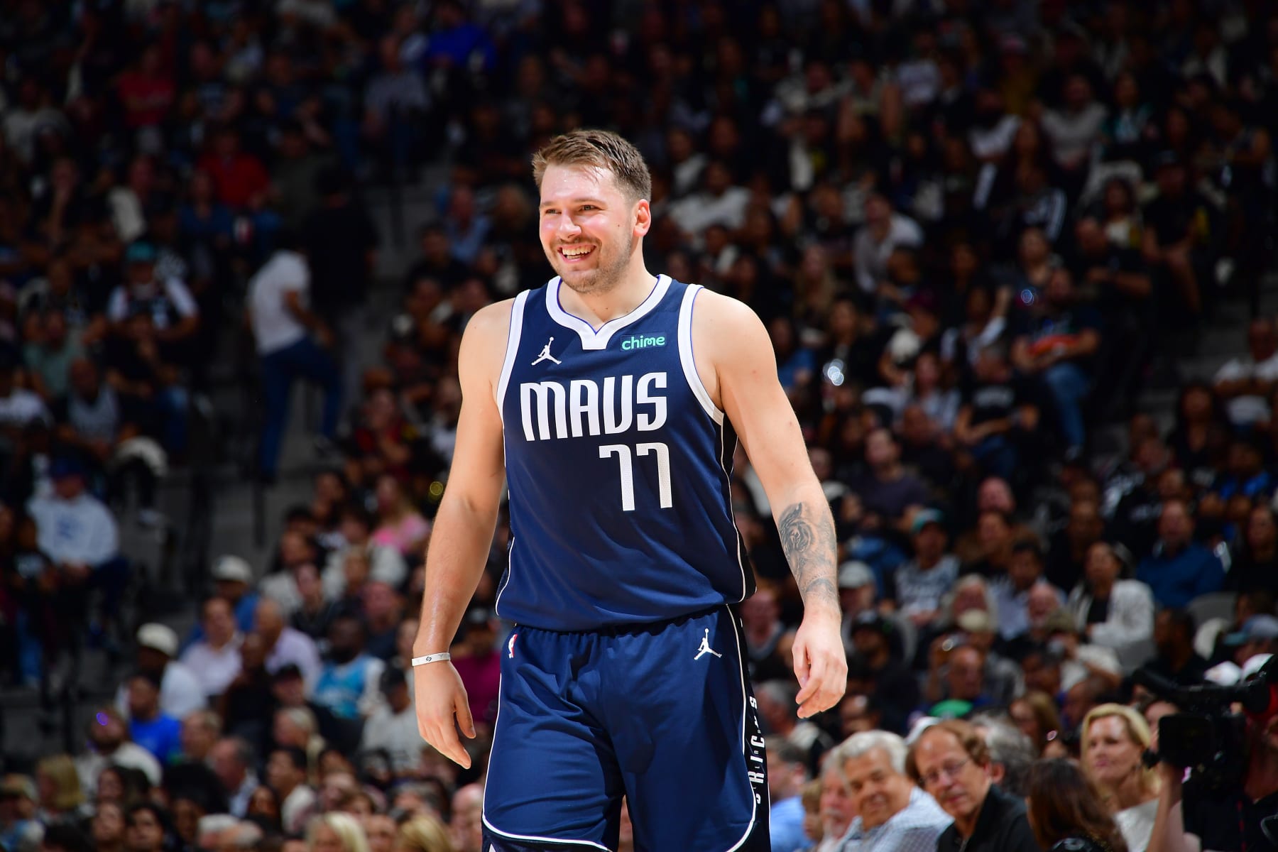 SAN ANTONIO, TX - OCTOBER 25: Luka Doncic #77 of the Dallas Mavericks smiles during the game against the San Antonio Spurs on October 25, 2023 at the Frost Bank Center in San Antonio, Texas. NOTE TO USER: User expressly acknowledges and agrees that, by downloading and or using this photograph, user is consenting to the terms and conditions of the Getty Images License Agreement. Mandatory Copyright Notice: Copyright 2023 NBAE (Photos by Michael Gonzales/NBAE via Getty Images)