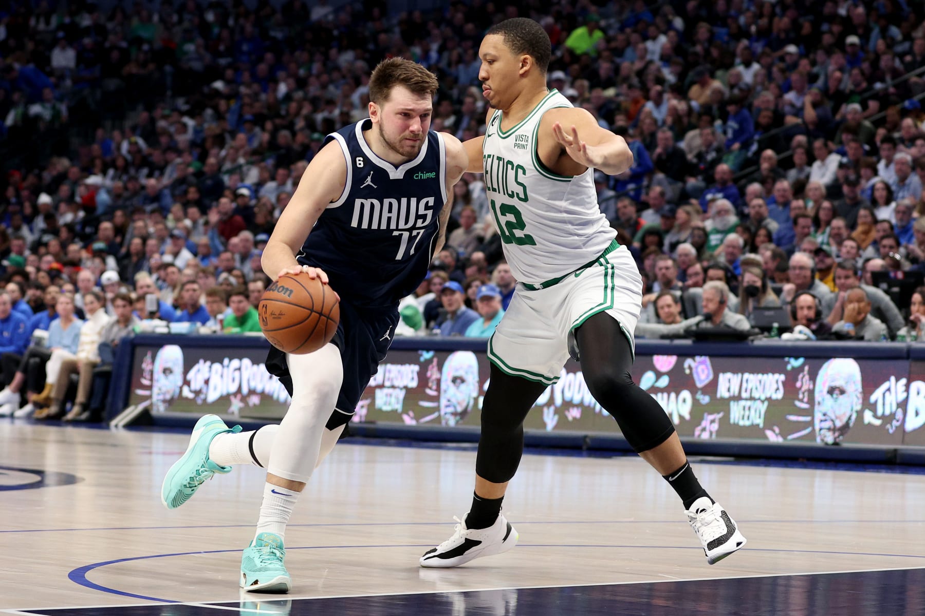 DALLAS, TEXAS - JANUARY 05: Luka Doncic #77 of the Dallas Mavericks drives to the basket against Grant Williams #12 of the Boston Celtics in the second half at American Airlines Center on January 05, 2023 in Dallas, Texas. NOTE TO USER: User expressly acknowledges and agrees that, by downloading and or using this photograph, User is consenting to the terms and conditions of the Getty Images License Agreement. (Photo by Tom Pennington/Getty Images)