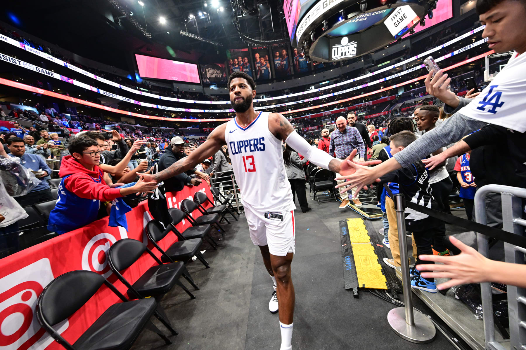LOS ANGELES, CA - APRIL 7: Paul George #13 of the LA Clippers high fives fans after the game against the Cleveland Cavaliers on April 7, 2024 at Crypto.Com Arena in Los Angeles, California. NOTE TO USER: User expressly acknowledges and agrees that, by downloading and/or using this Photograph, user is consenting to the terms and conditions of the Getty Images License Agreement. Mandatory Copyright Notice: Copyright 2024 NBAE (Photo by Adam Pantozzi/NBAE via Getty Images)
