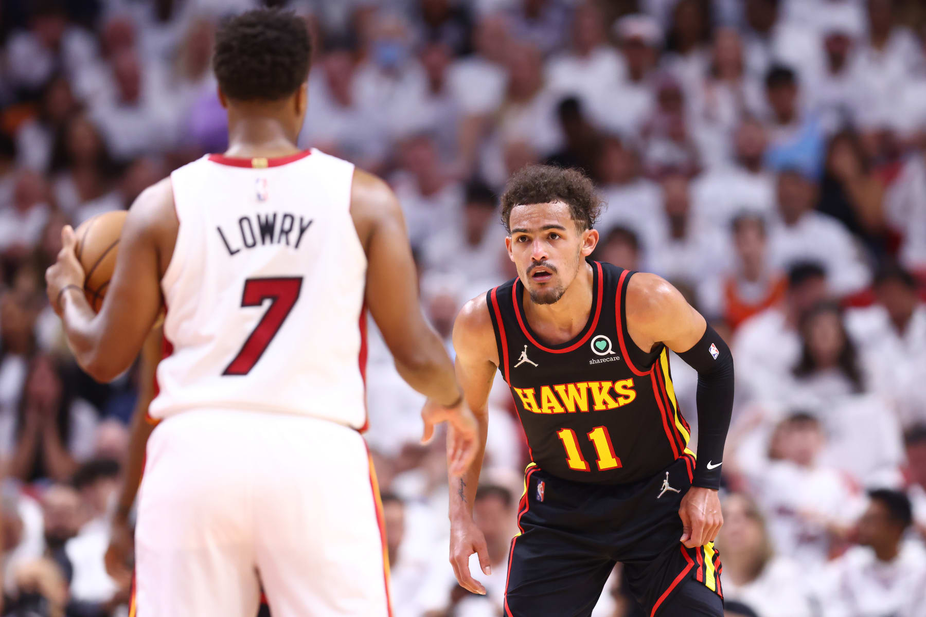 MIAMI, FLORIDA - APRIL 19: Trae Young #11 of the Atlanta Hawks defends Kyle Lowry #7 of the Miami Heat during the second quarter in Game Two of the Eastern Conference First Round at FTX Arena on April 19, 2022 in Miami, Florida. NOTE TO USER: User expressly acknowledges and agrees that, by downloading and or using this photograph, User is consenting to the terms and conditions of the Getty Images License Agreement.  (Photo by Michael Reaves/Getty Images)