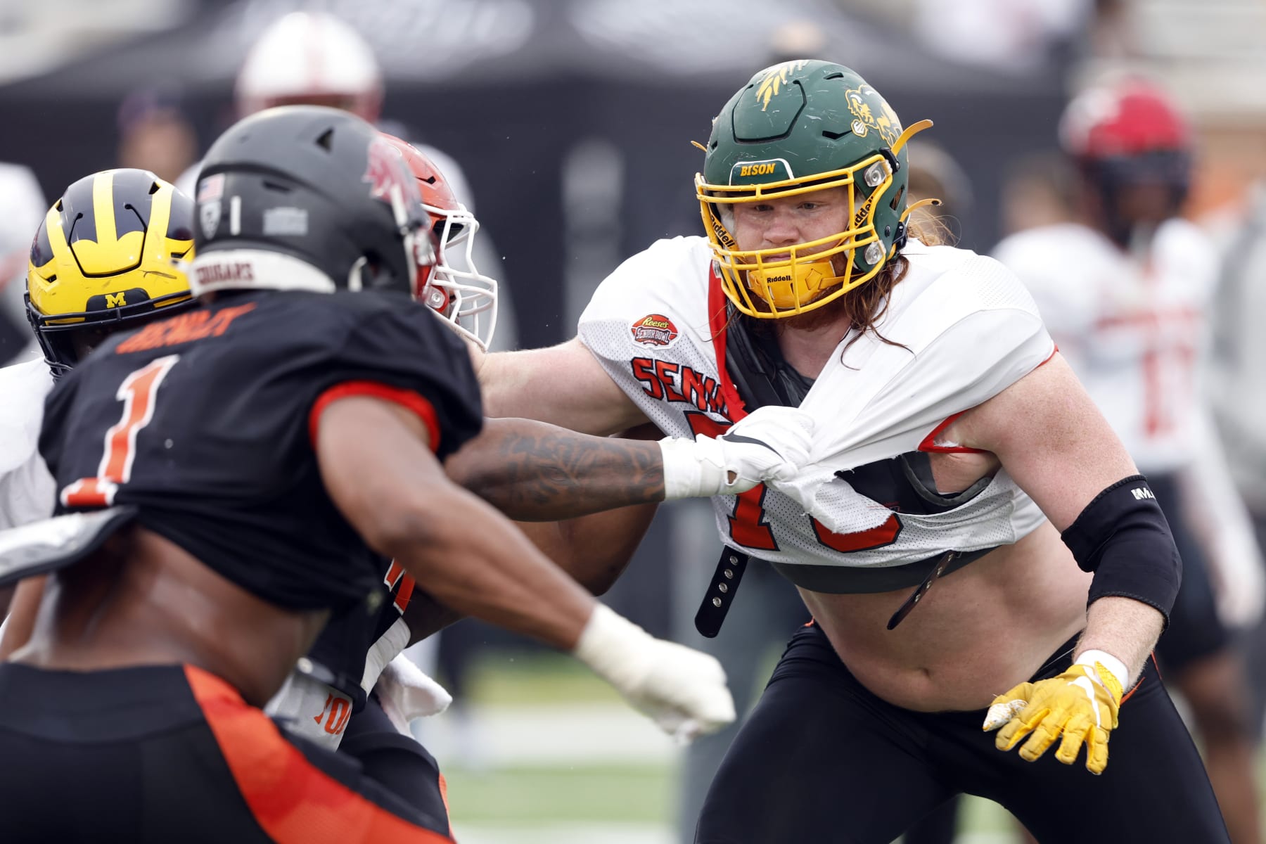 National offensive lineman Cody Mauch of North Dakota State (70) runs drills during practice for the Senior Bowl NCAA college football game Thursday, Feb. 2, 2023, in Mobile, Ala.. (AP Photo/Butch Dill)