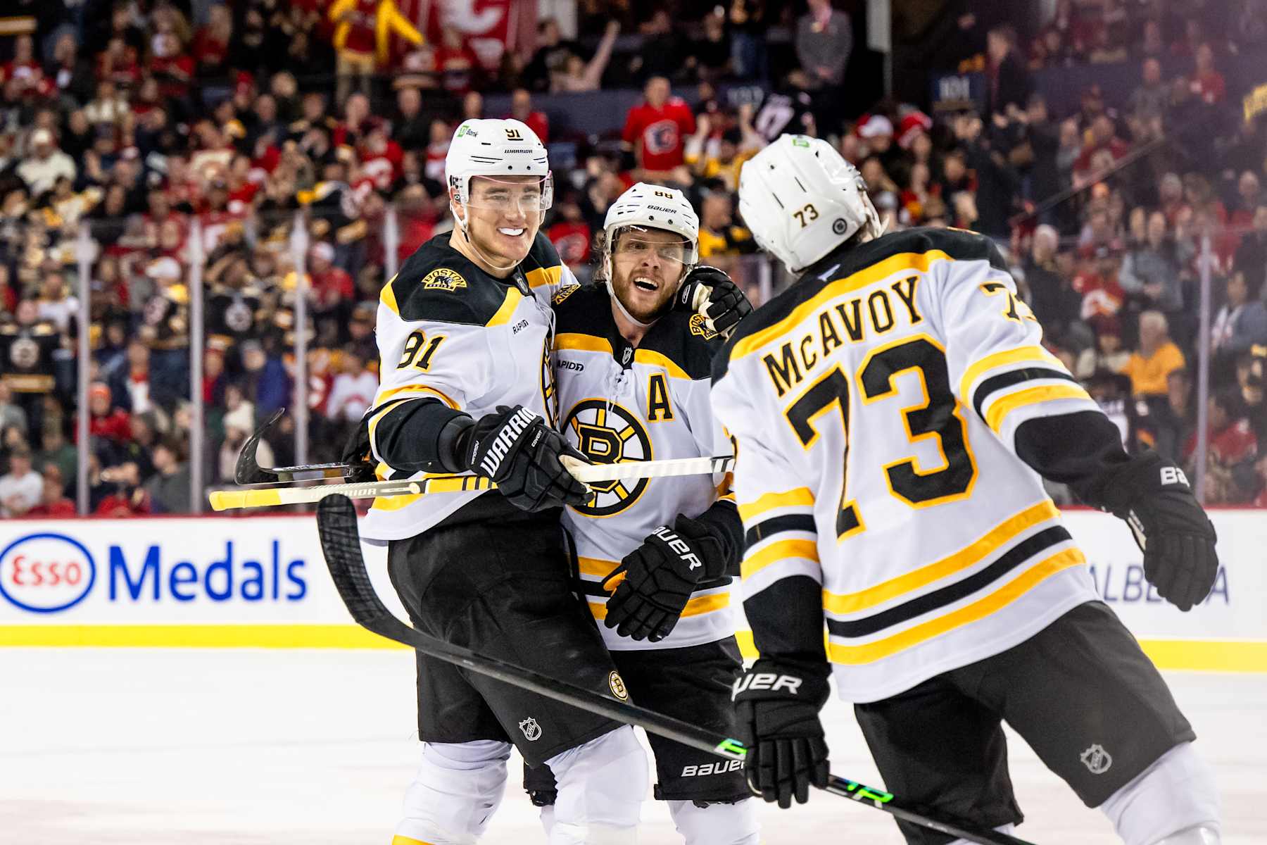 Nikita Zadorov, David PastrÅák and Charlie McAvoy.