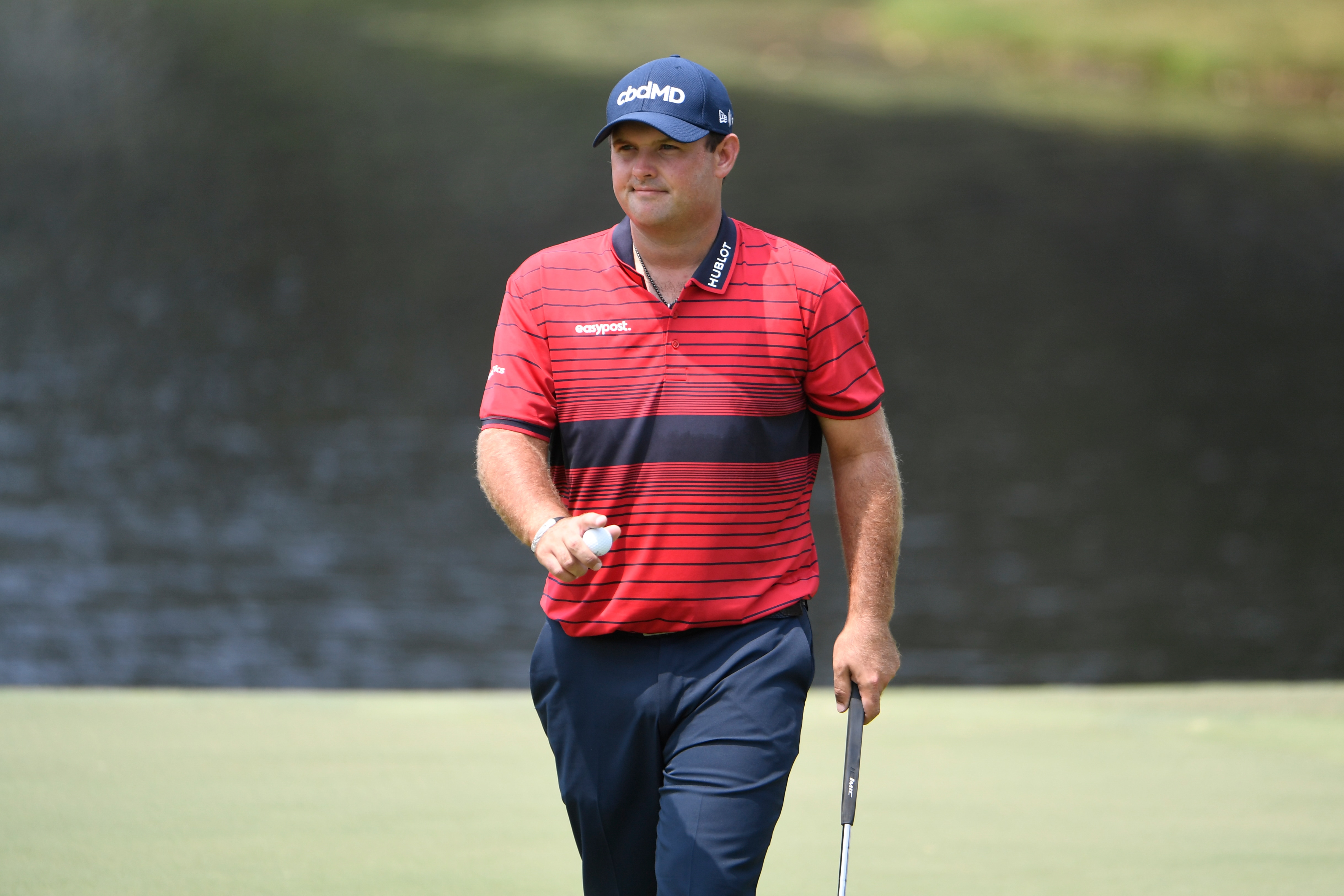 MEMPHIS, TN - AUGUST 08: Patrick Reed at the ninth green does a ball wave during the final round of the World Golf Championships-FedEx St. Jude Invitational at TPC Southwind on August 8, 2021 in Memphis, Tennessee. (Photo by Tracy Wilcox/PGA TOUR via Getty Images)