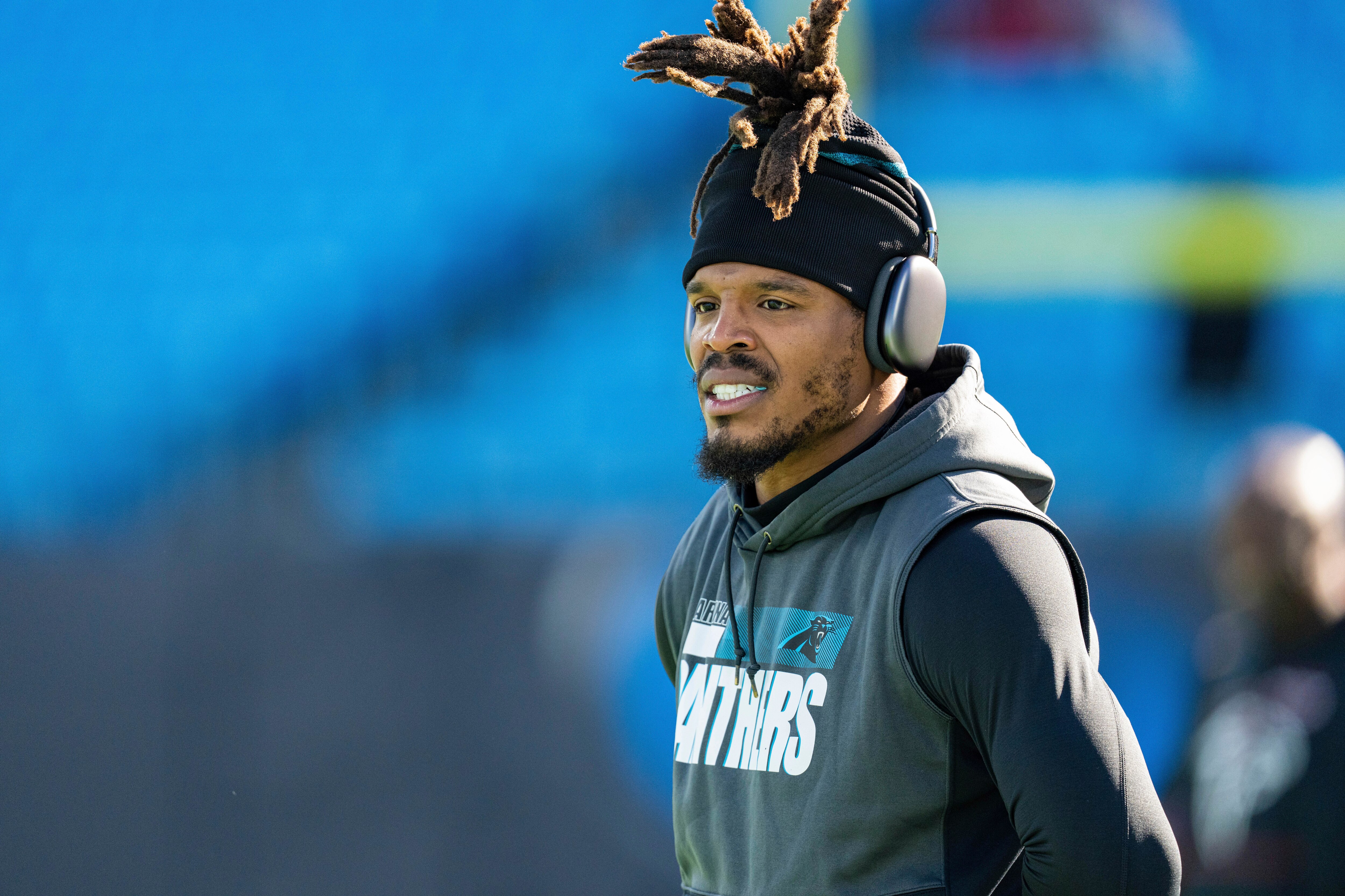Carolina Panthers quarterback Cam Newton (1) warms up before an NFL football game against the Atlanta Falcons Sunday, Dec. 12, 2021, in Charlotte, N.C. (AP Photo/Jacob Kupferman)