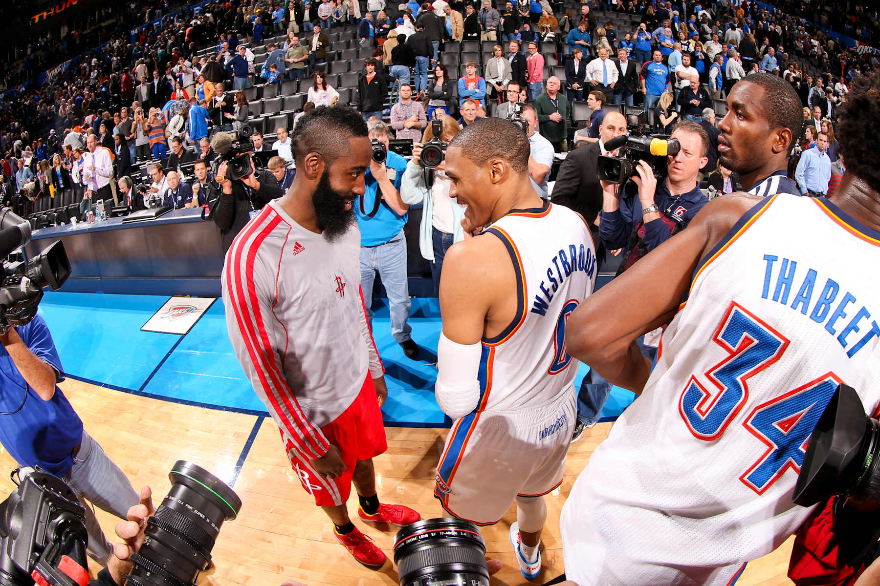 OKLAHOMA CITY, OK - NOVEMBER 28: Russell Westbrook #0 of the Oklahoma City Thunder greets former teammate James Harden #13 of the Houston Rockets following their game on November 28, 2012 at the Chesapeake Energy Arena in Oklahoma City, Oklahoma. NOTE TO USER: User expressly acknowledges and agrees that, by downloading and or using this photograph, user is consenting to the terms and conditions of the Getty Images License Agreement. Mandatory Copyright Notice: Copyright 2012 NBAE (Photo by Layne Murdoch/NBAE via Getty Images)