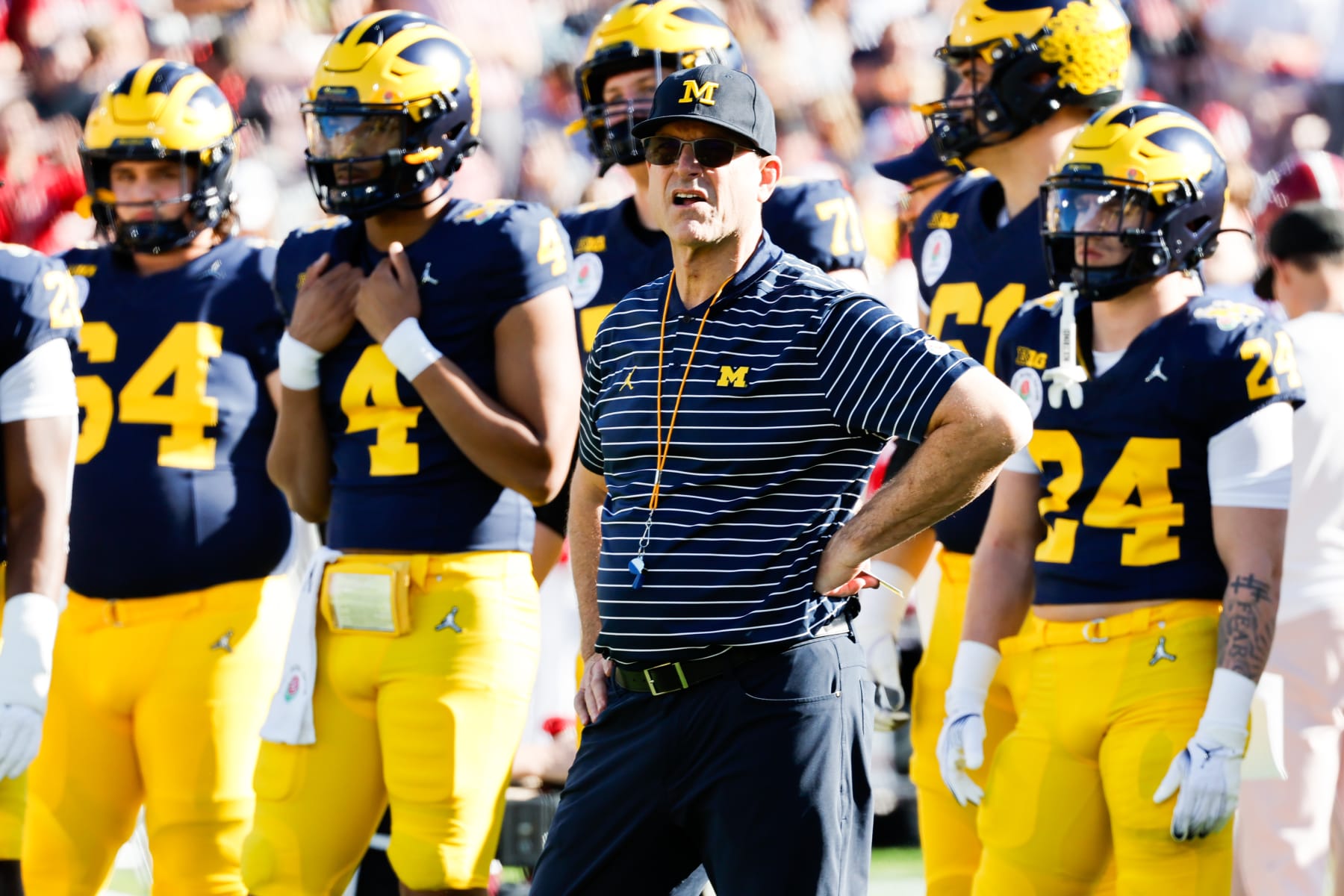 PASADENA, CA - JANUARY 01: Michigan Wolverines head coach Jim Harbaugh watches his team warm up before the College Football Playoff semifinals against the Alabama Crimson Tide during the Rose Bowl game at Rose Bowl in Pasadena Monday, Jan. 1, 2024. (Gina Ferazzi / Los Angeles Times via Getty Images)