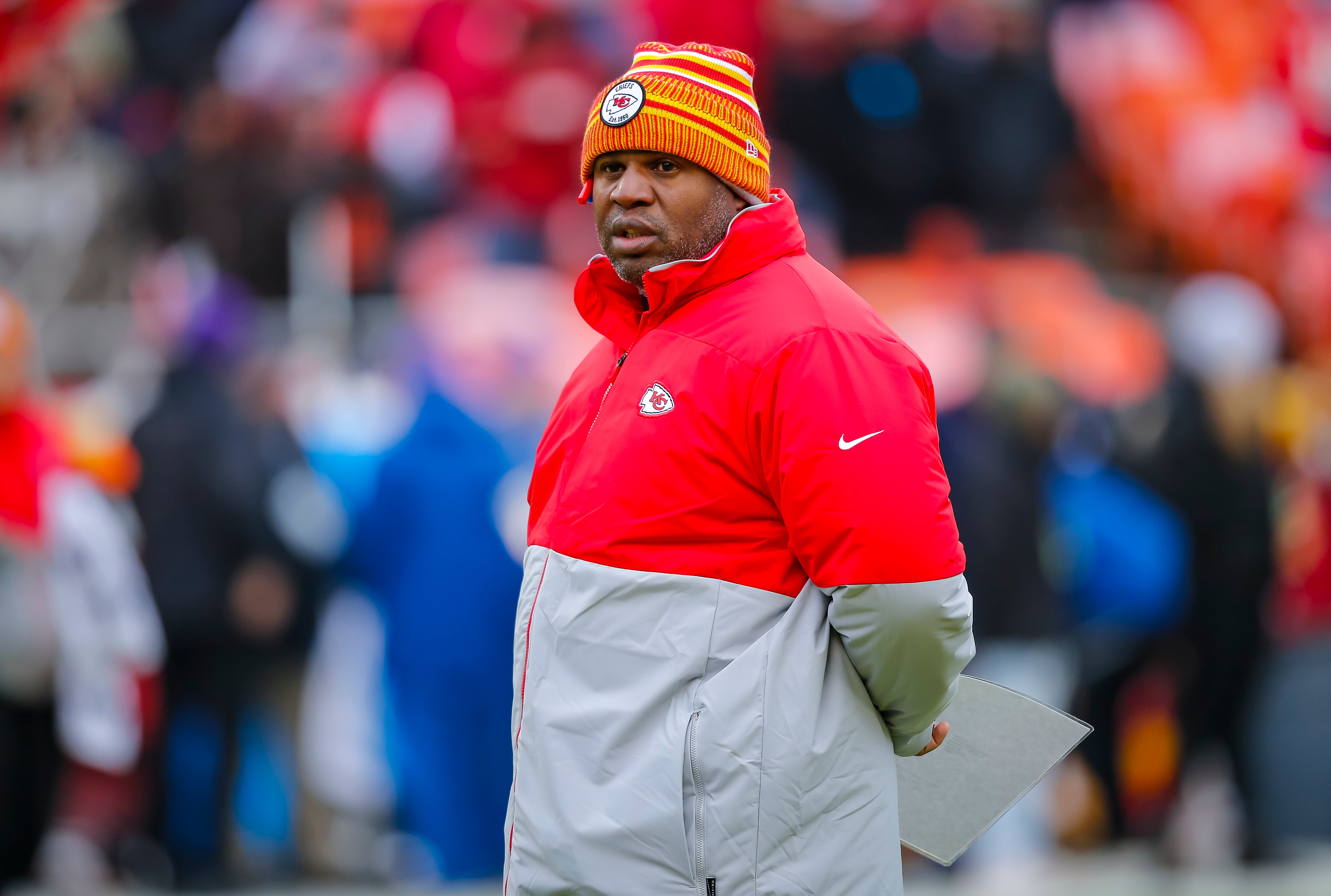 KANSAS CITY, MO - JANUARY 12: Kansas City Chiefs offensive coordinator Eric Bieniemy watches pregame warmups prior to the AFC Divisional playoff game against the Houston Texans at Arrowhead Stadium on January 12, 2020 in Kansas City, Missouri. (Photo by David Eulitt/Getty Images)