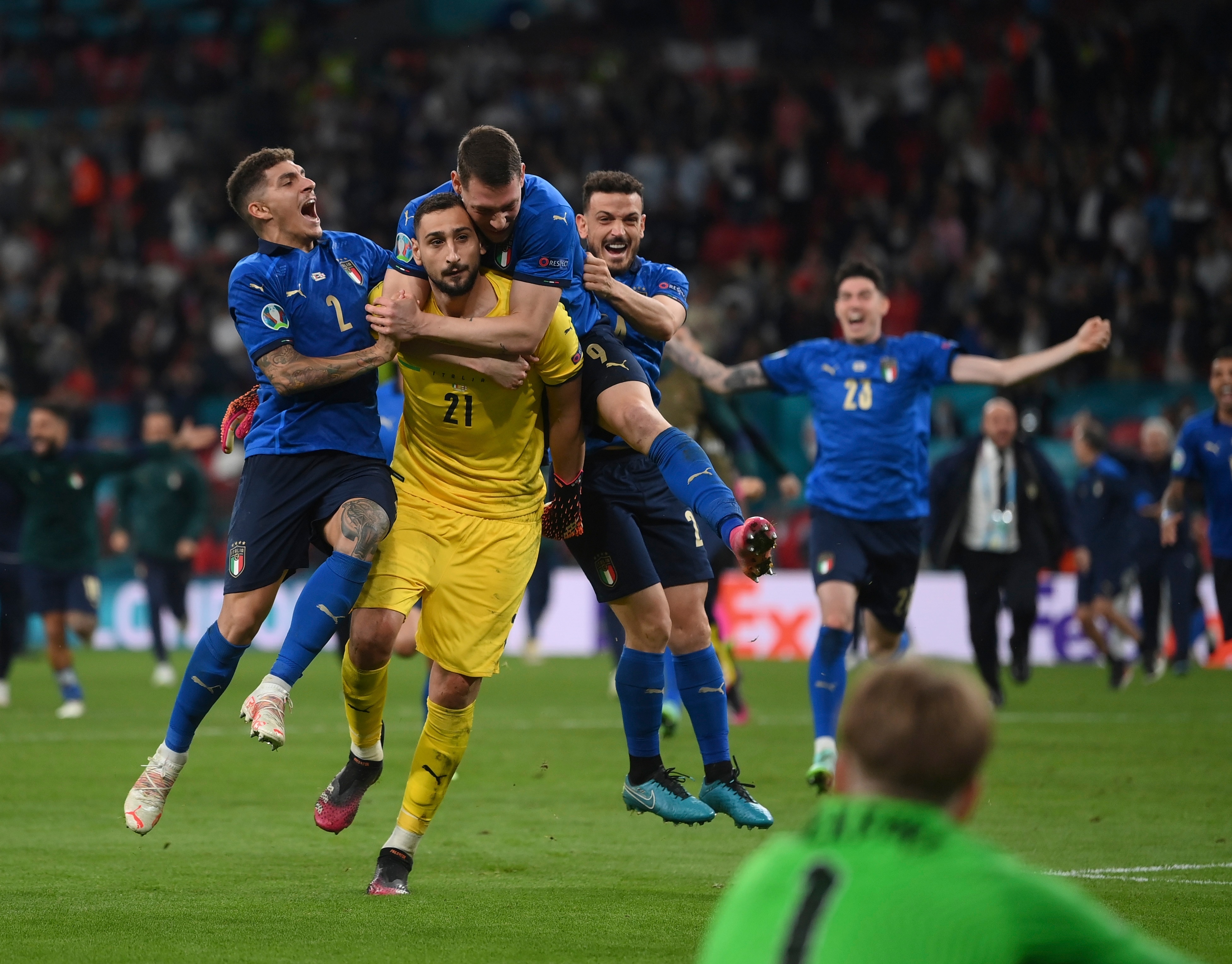 Italian players celebrate after the penalty shootout of the Euro 2020 soccer final match between England and Italy at Wembley stadium in London, Sunday, July 11, 2021. (Laurence Griffiths/Pool via AP)