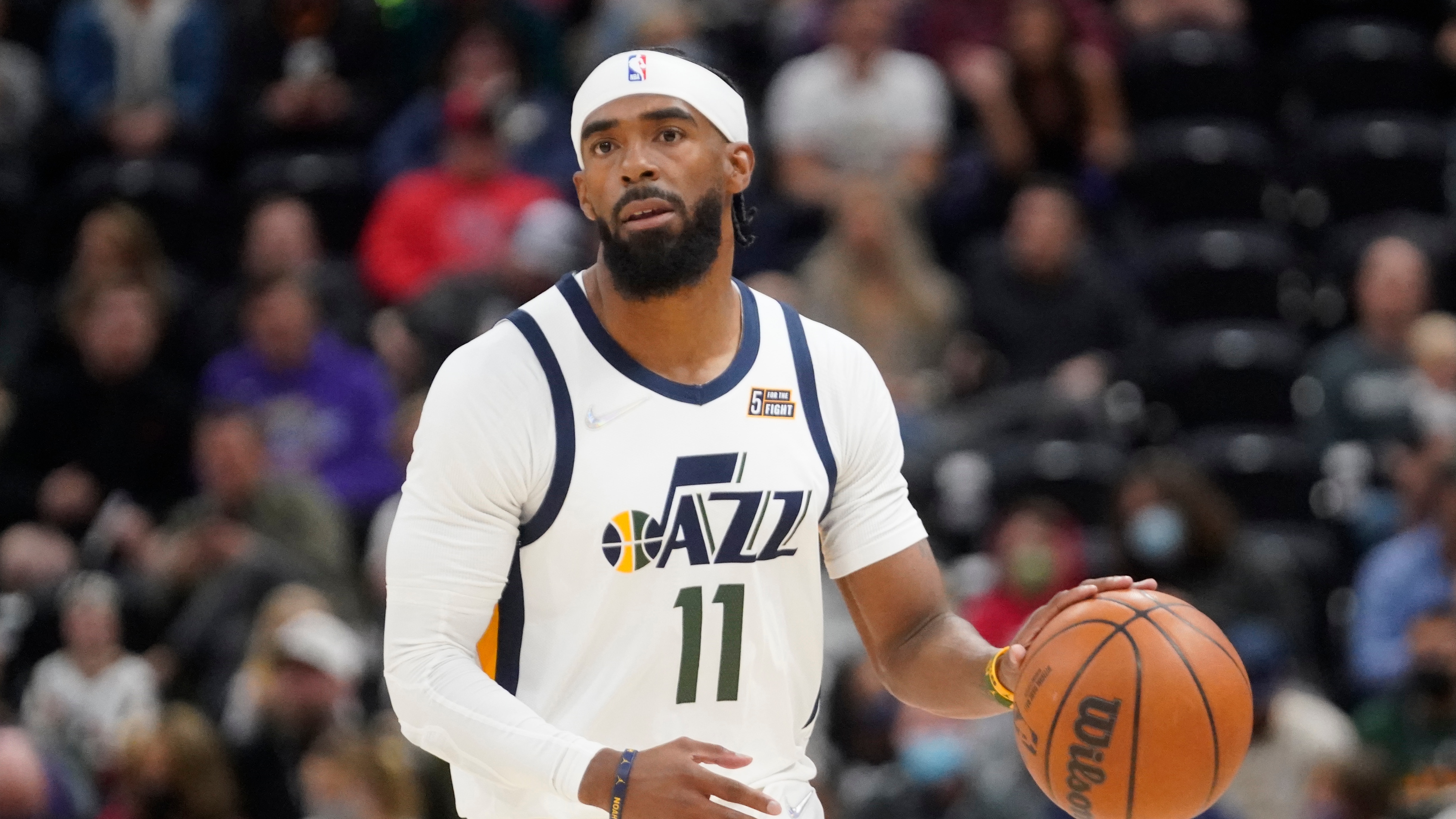 Utah Jazz guard Mike Conley (11) brings the ball up court in the first half of a preseason NBA basketball gameagainst the Milwaukee Bucks Wednesday, Oct. 13, 2021, in Salt Lake City. (AP Photo/Rick Bowmer)
