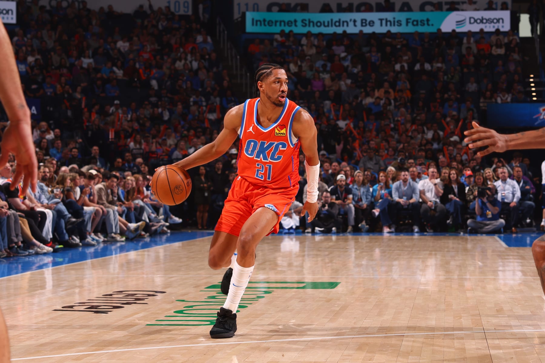 OKLAHOMA CITY, OK - MARCH 29:  Aaron Wiggins #21 of the Oklahoma City Thunder handles the ball during the game against the Phoenix Suns on March 29, 2024 at Paycom Arena in Oklahoma City, Oklahoma. NOTE TO USER: User expressly acknowledges and agrees that, by downloading and or using this photograph, User is consenting to the terms and conditions of the Getty Images License Agreement. Mandatory Copyright Notice: Copyright 2024 NBAE (Photo by Zach Beeker/NBAE via Getty Images)