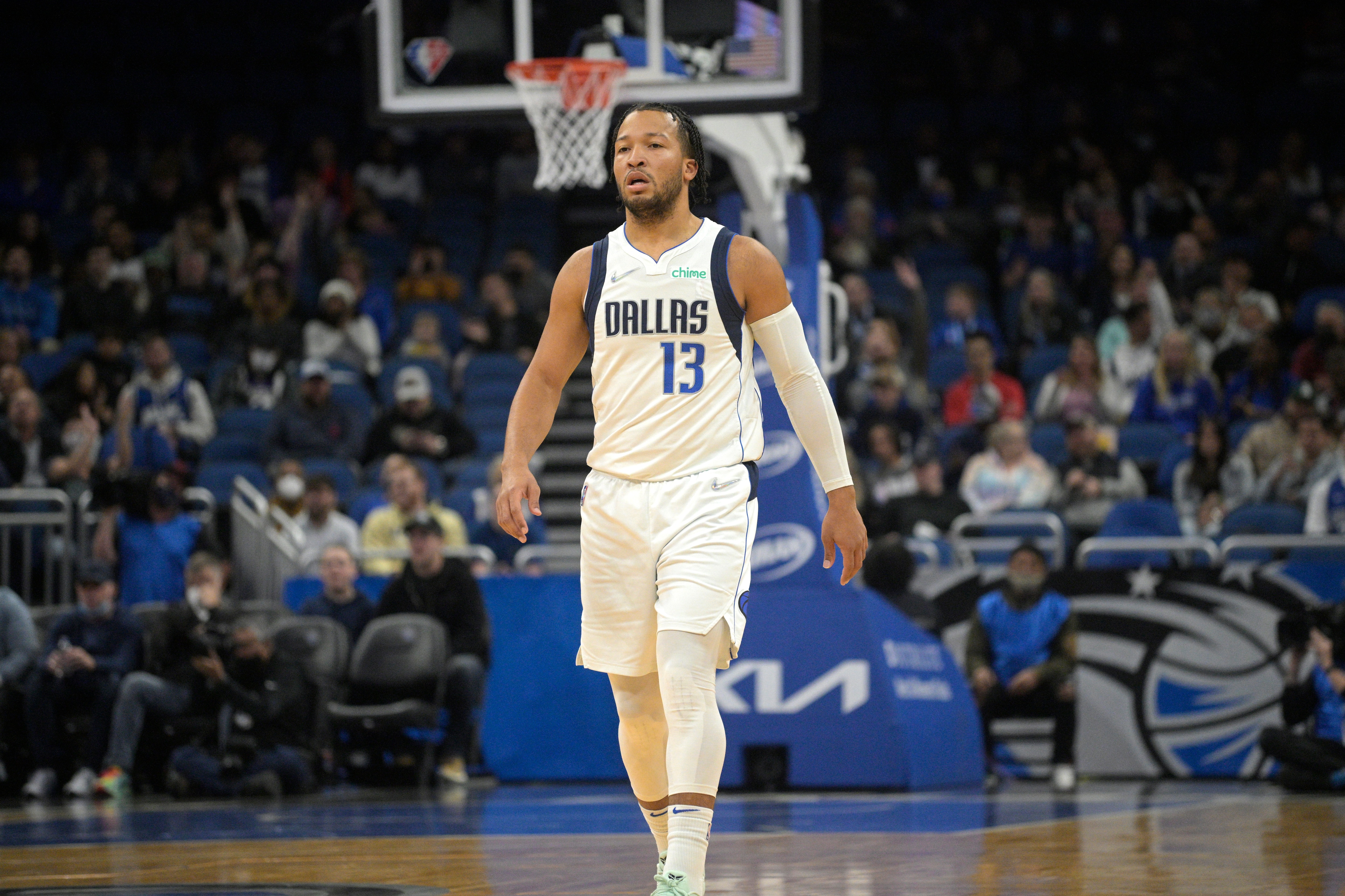 Dallas Mavericks guard Jalen Brunson (13) stands on the court during the first half of an NBA basketball game against the Orlando Magic, Sunday, Jan. 30, 2022, in Orlando, Fla. (AP Photo/Phelan M. Ebenhack)