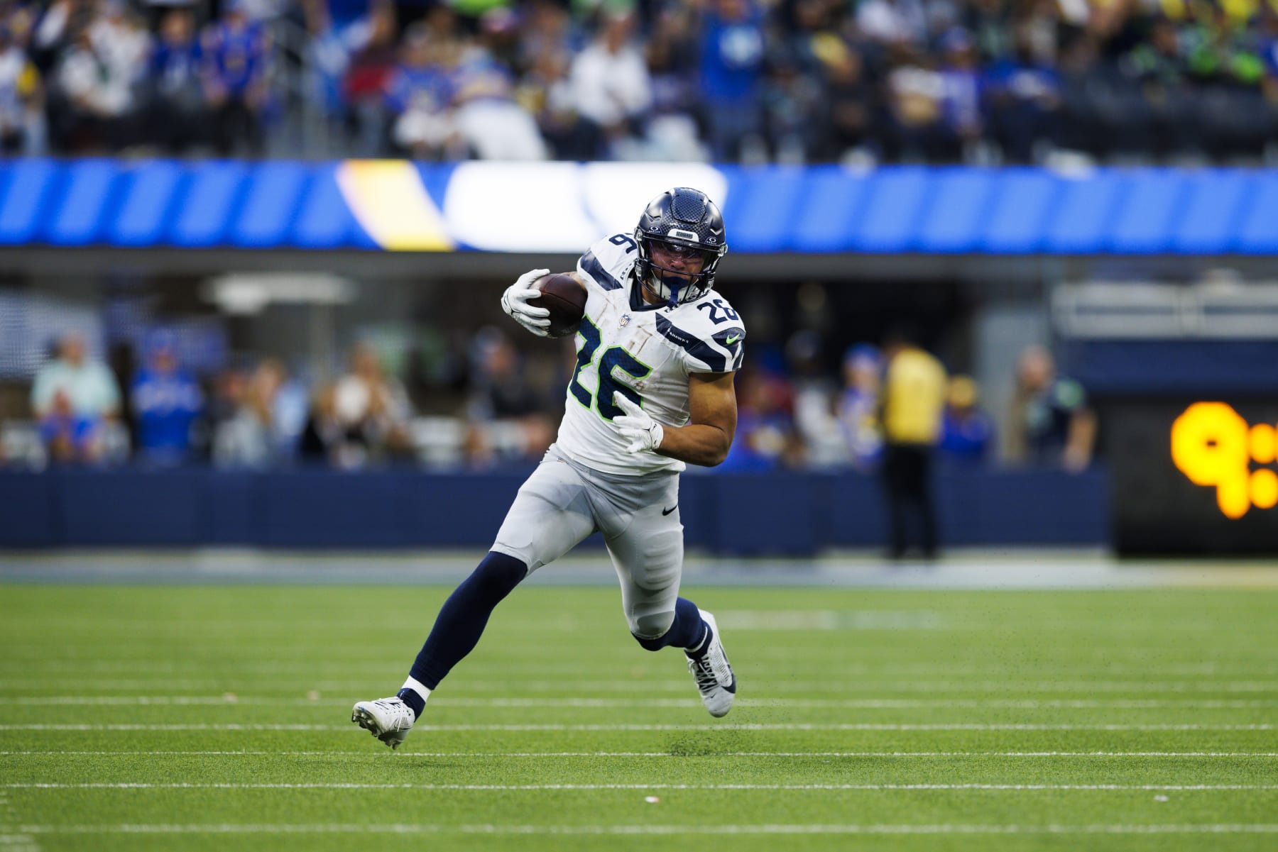 INGLEWOOD, CALIFORNIA - NOVEMBER 19: Zach Charbonnet #26 of the Seattle Seahawks runs with the ball during a game against the Los Angeles Rams at SoFi Stadium on November 19, 2023 in Inglewood, California. (Photo by Ric Tapia/Getty Images)