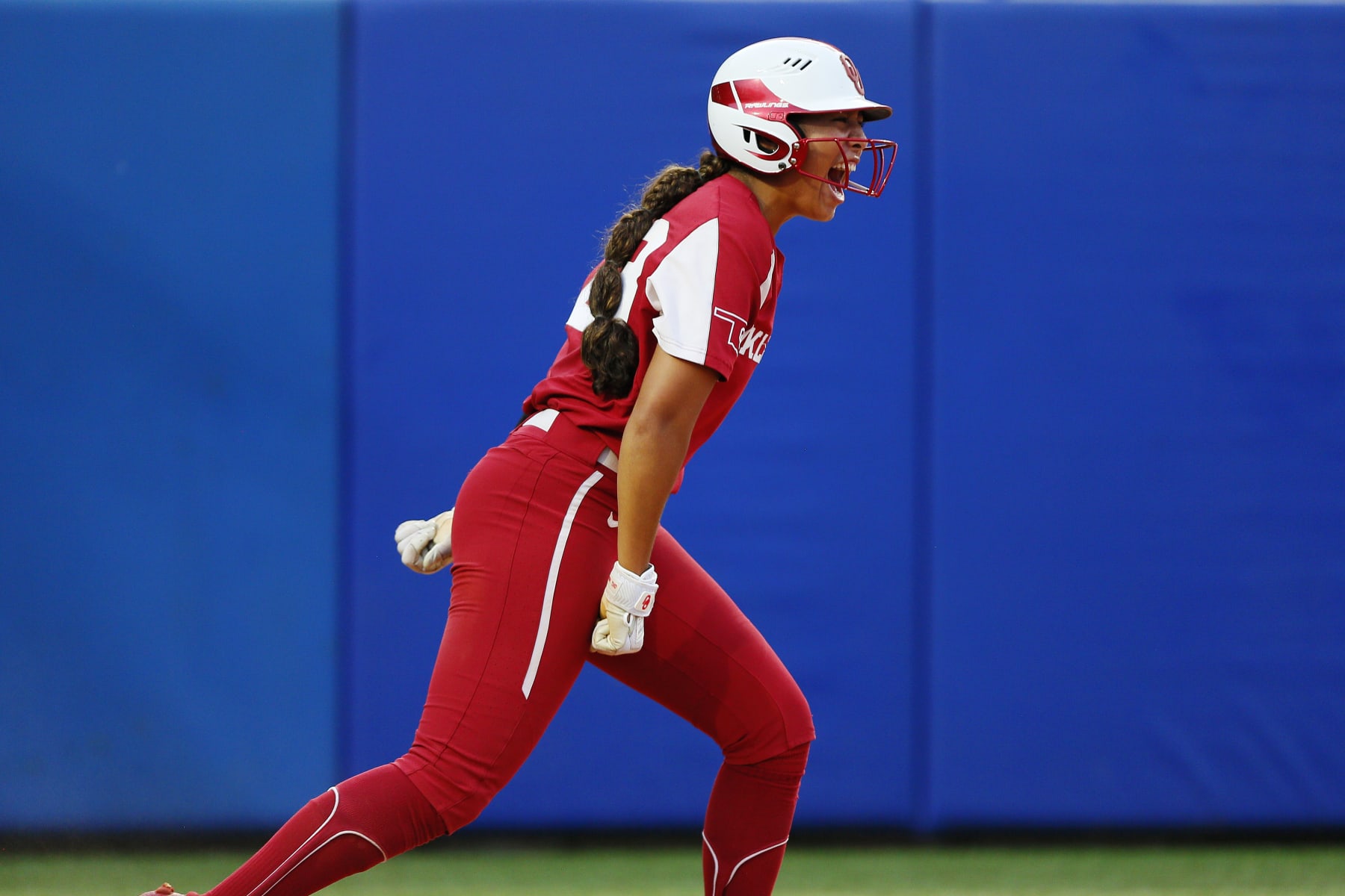 OKLAHOMA CITY, OK - JUNE 9:  Tiare Jennings #23 of the Oklahoma Sooners celebrates after scoring to take a lead against the Texas Longhorns during the NCAA Women's College World Series finals at the USA Softball Hall of Fame Complex on June 9, 2022 in Oklahoma City, Oklahoma.  Oklahoma won the NCAA Championship with a 10-5 victory.  (Photo by Brian Bahr/Getty Images)
