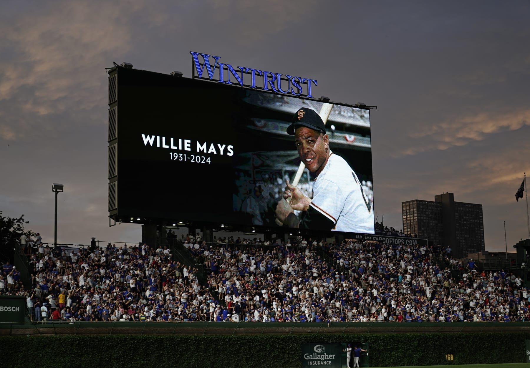 CHICAGO, ILLINOIS - JUNE 18: An image of Willie Mays is displayed on the video board while everyone observed a moment of silence during the sixth inning of a game between the Chicago Cubs and the San Francisco Giants at Wrigley Field on June 18, 2024 in Chicago, Illinois. The Cubs defeated the Giants 5-2. (Photo by Nuccio DiNuzzo/Getty Images)