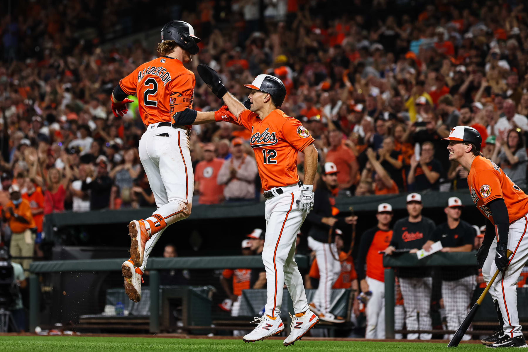 BALTIMORE, MD - SEPTEMBER 16: Gunnar Henderson #2 of the Baltimore Orioles celebrates with Adam Frazier #12 after hitting a two run home run against the Tampa Bay Rays during the second inning at Oriole Park at Camden Yards on September 16, 2023 in Baltimore, Maryland. (Photo by Scott Taetsch/Getty Images)